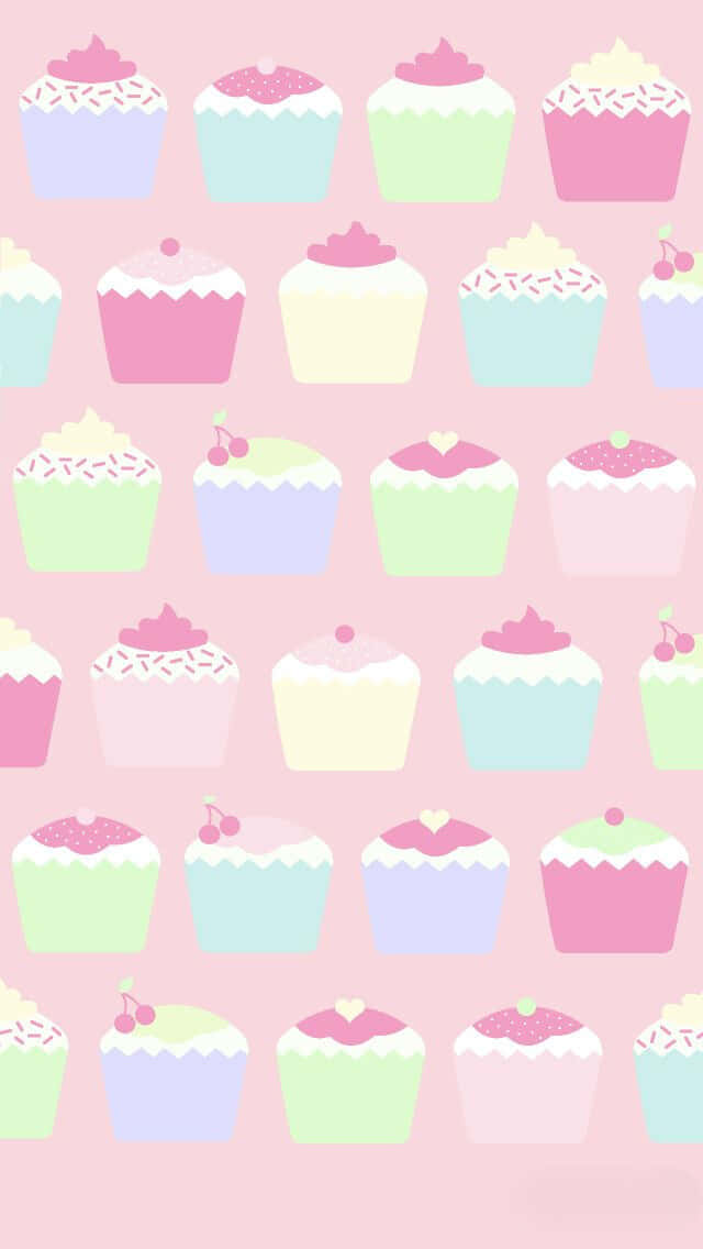 Cute Cupcake 桌布 壁紙 — 粉紅色背景上，帶有糖霜和櫻桃的柔和色紙杯蛋糕以甜美重複圖案排列。