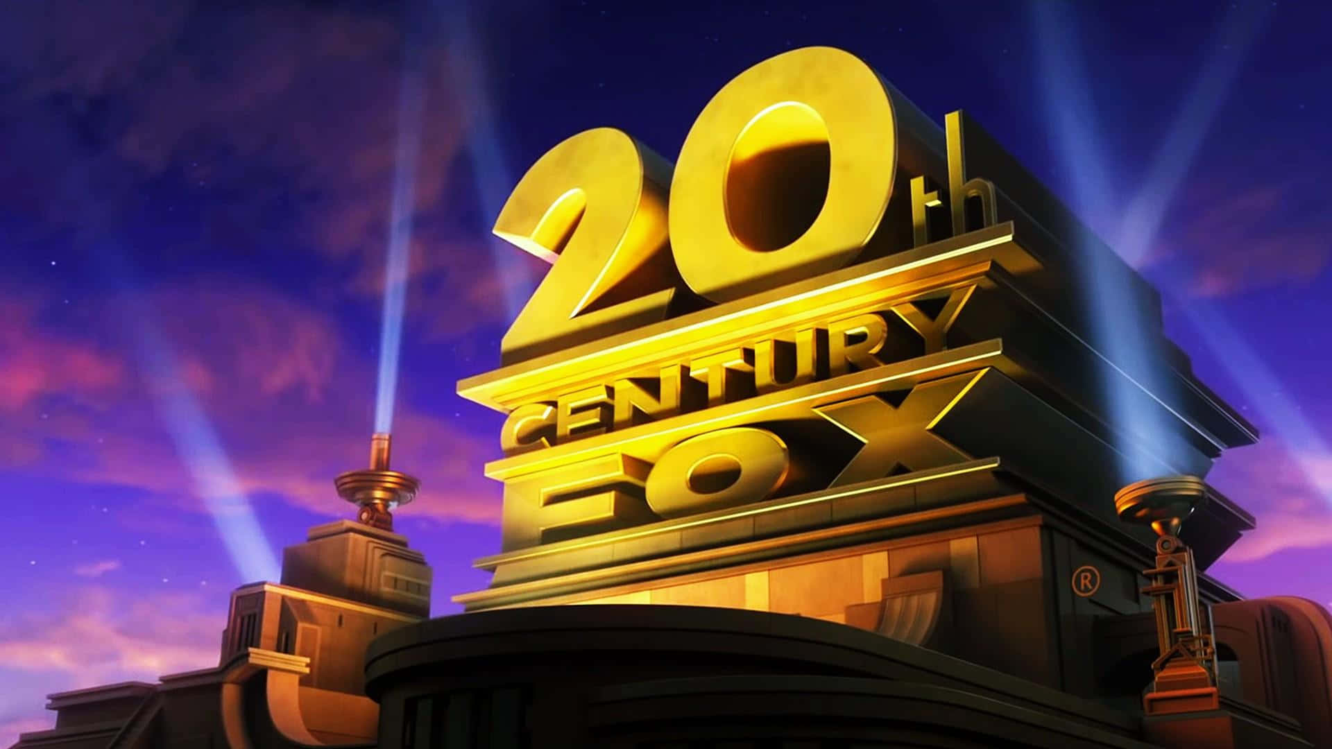 金色嘅20th Century Fox標誌喺黃昏被射燈照亮。