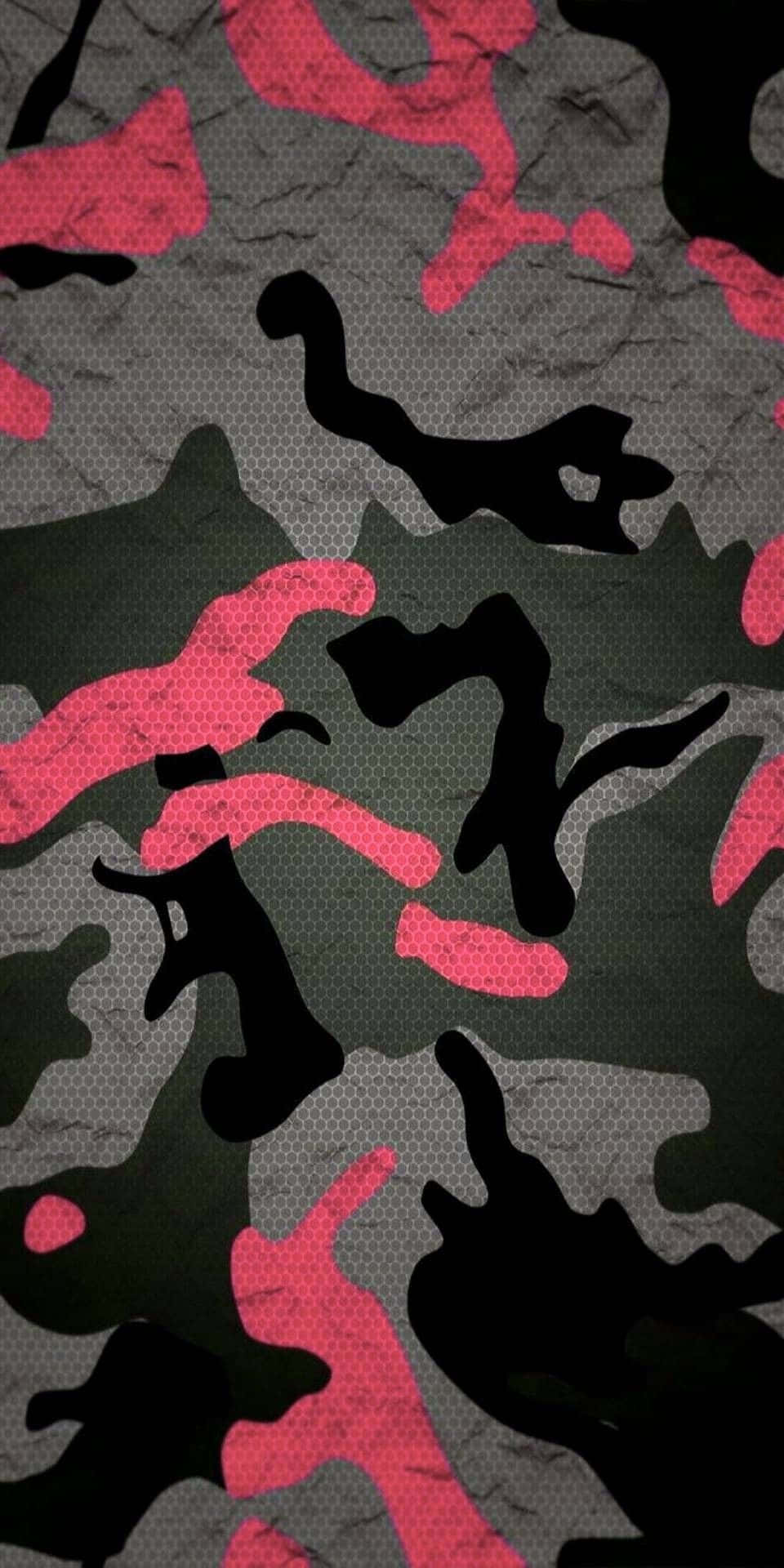 紋理布料上的粉紅色、黑色和灰色迷彩圖案。