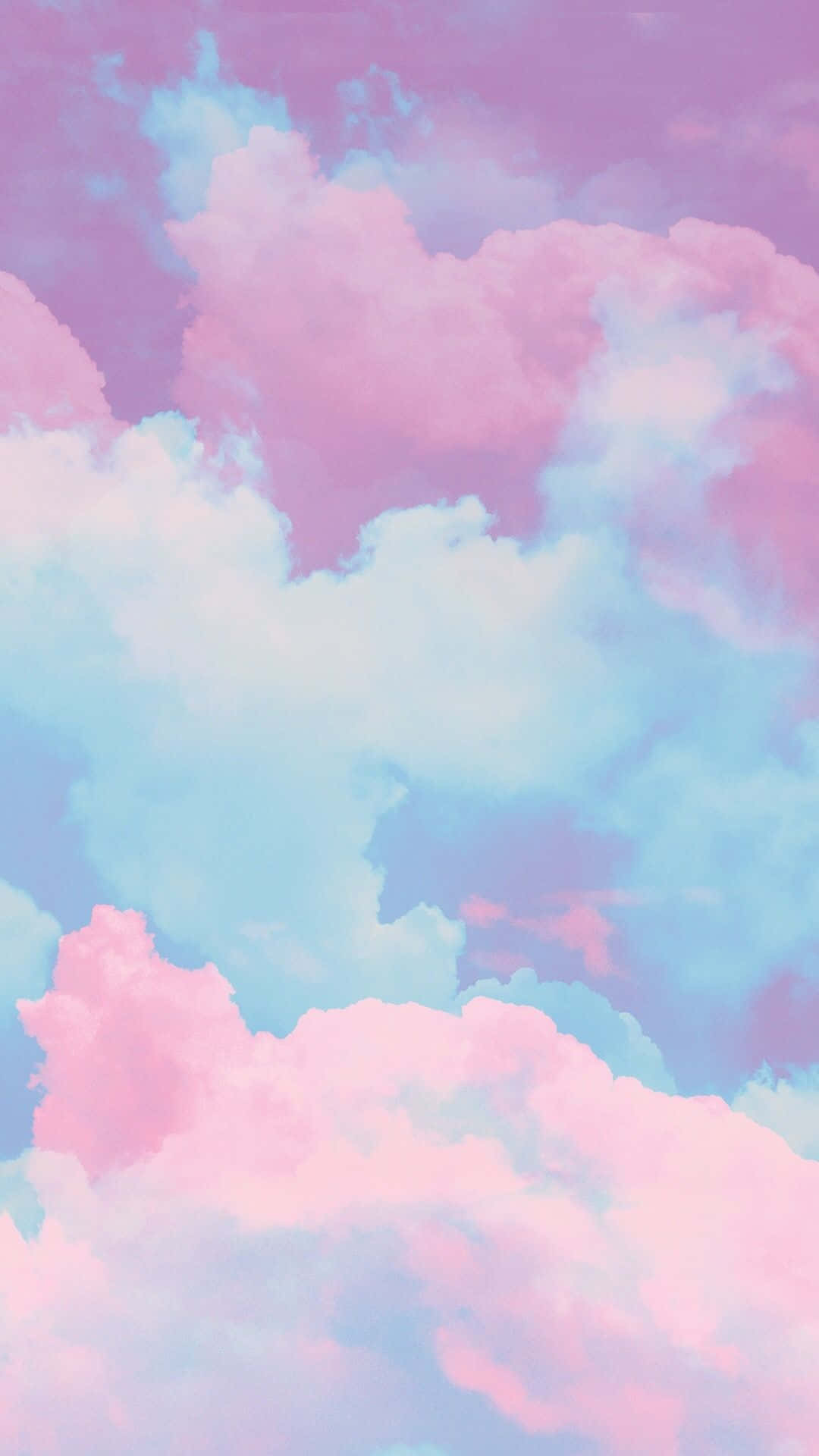 粉彩粉紅和藍色雲朵漂浮在夢幻的天空中。