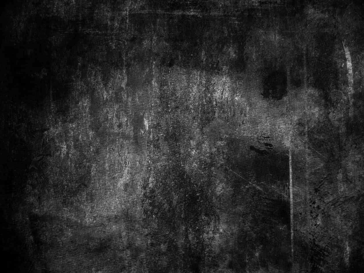 Black And White Texture 桌布 壁紙 — 粗糙嘅單色紋理，帶有深邃黑色同抹污嘅污垢，顯露出磨損嘅表面。