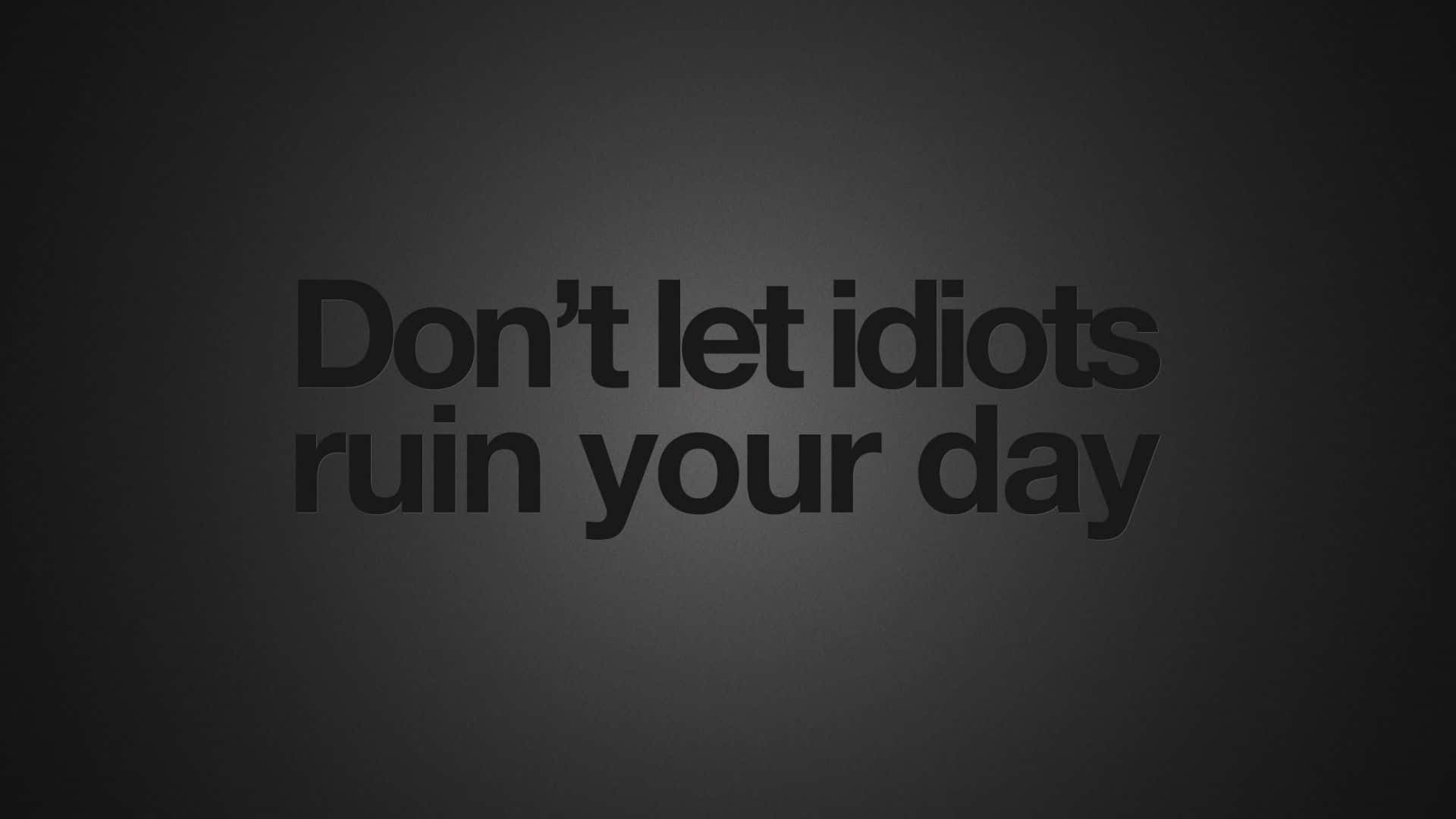 鼓舞人心的 桌布 壁紙 — 粗體文字寫著「Don't let idiots ruin your day」，背景為深色漸變。