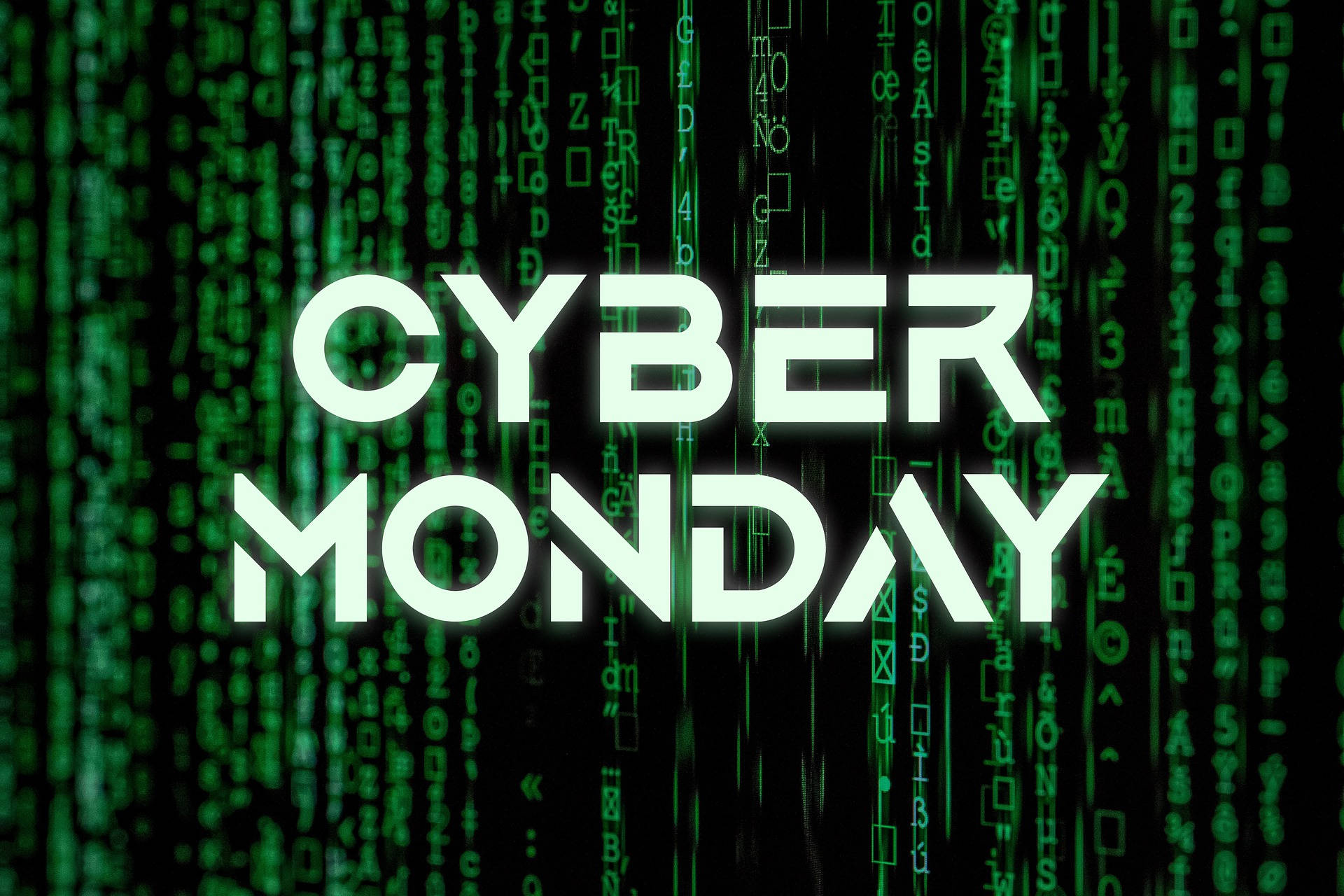 科技 桌布 壁紙 — 粗體白色 'CYBER MONDAY' 文字在黑色背景上發光，並帶有層疊的綠色數位代碼。