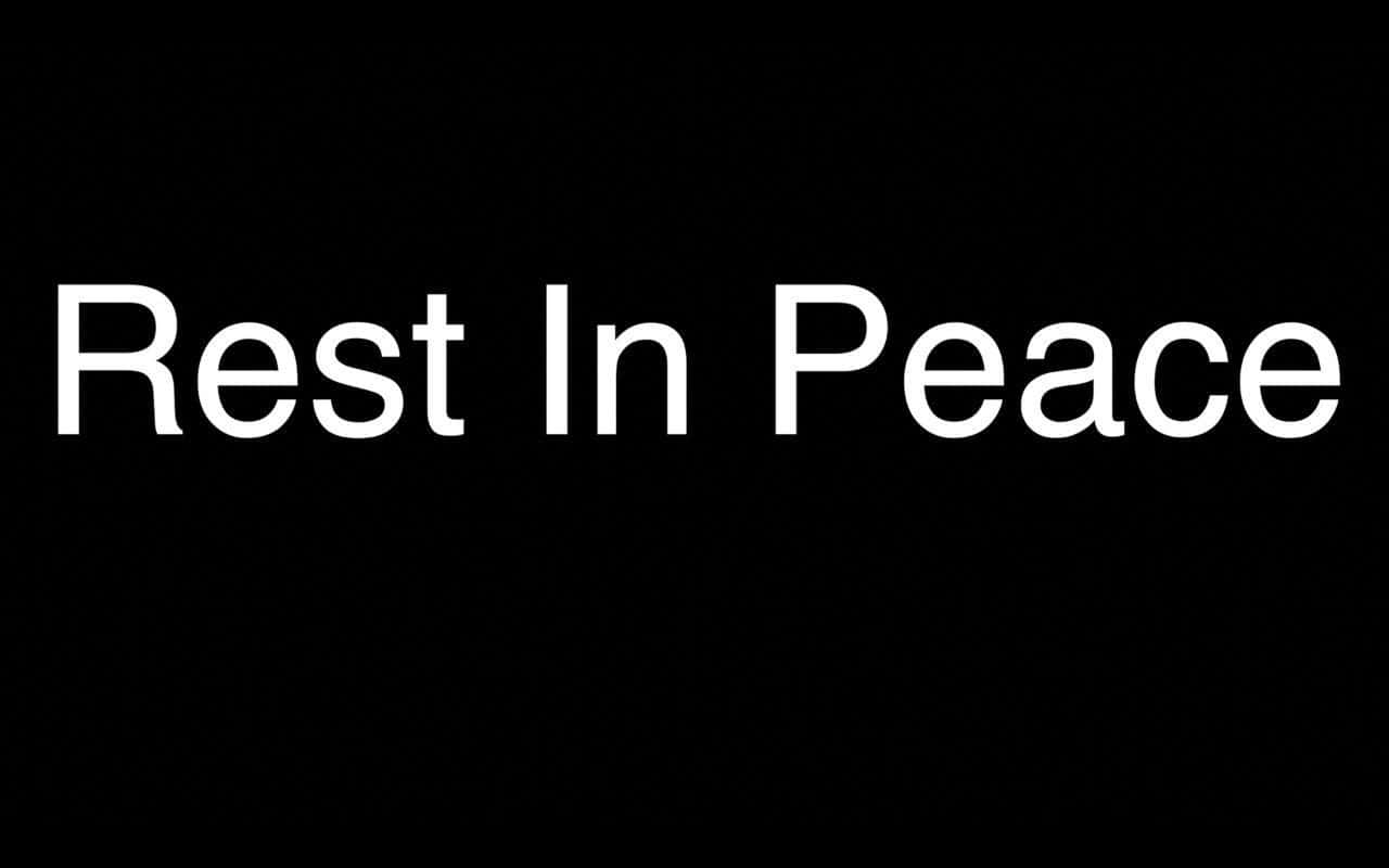 裂開 桌布 壁紙 — 粗體白色文字寫著「Rest In Peace」，居中在純黑色背景上。