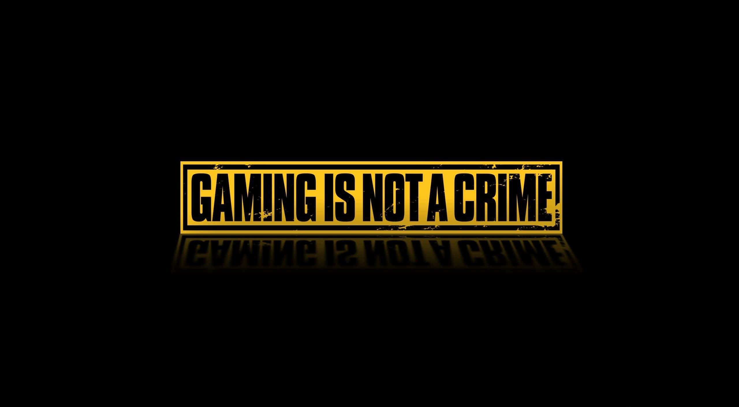 YouTube Gaming 桌布 壁紙 — 粗體黃色文字宣稱遊戲不是犯罪，背景為黑色並帶有微妙的倒影。