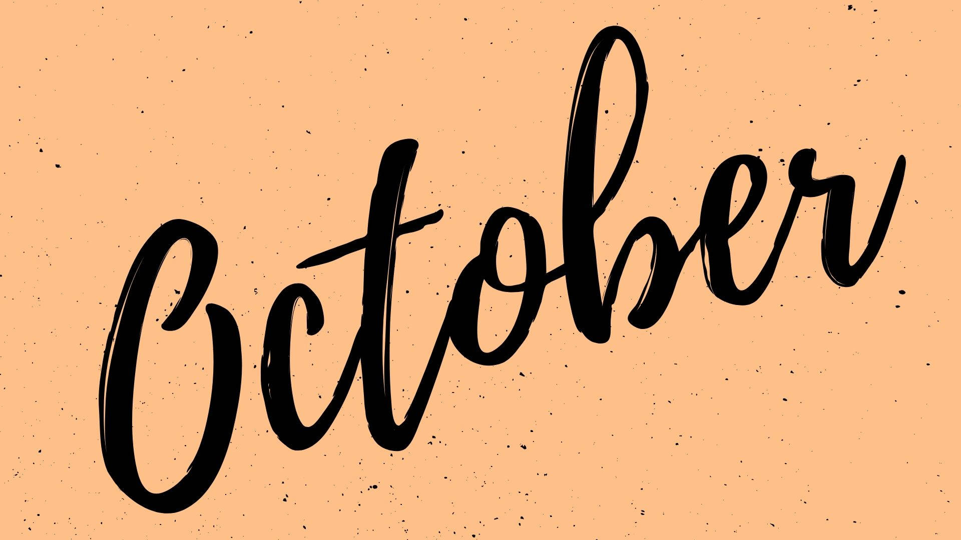 Hello 桌布 壁紙 — 粗體黑色刷字體書寫的「October」一詞在帶有細微斑點的紋理蜜桃色背景上脫穎而出。