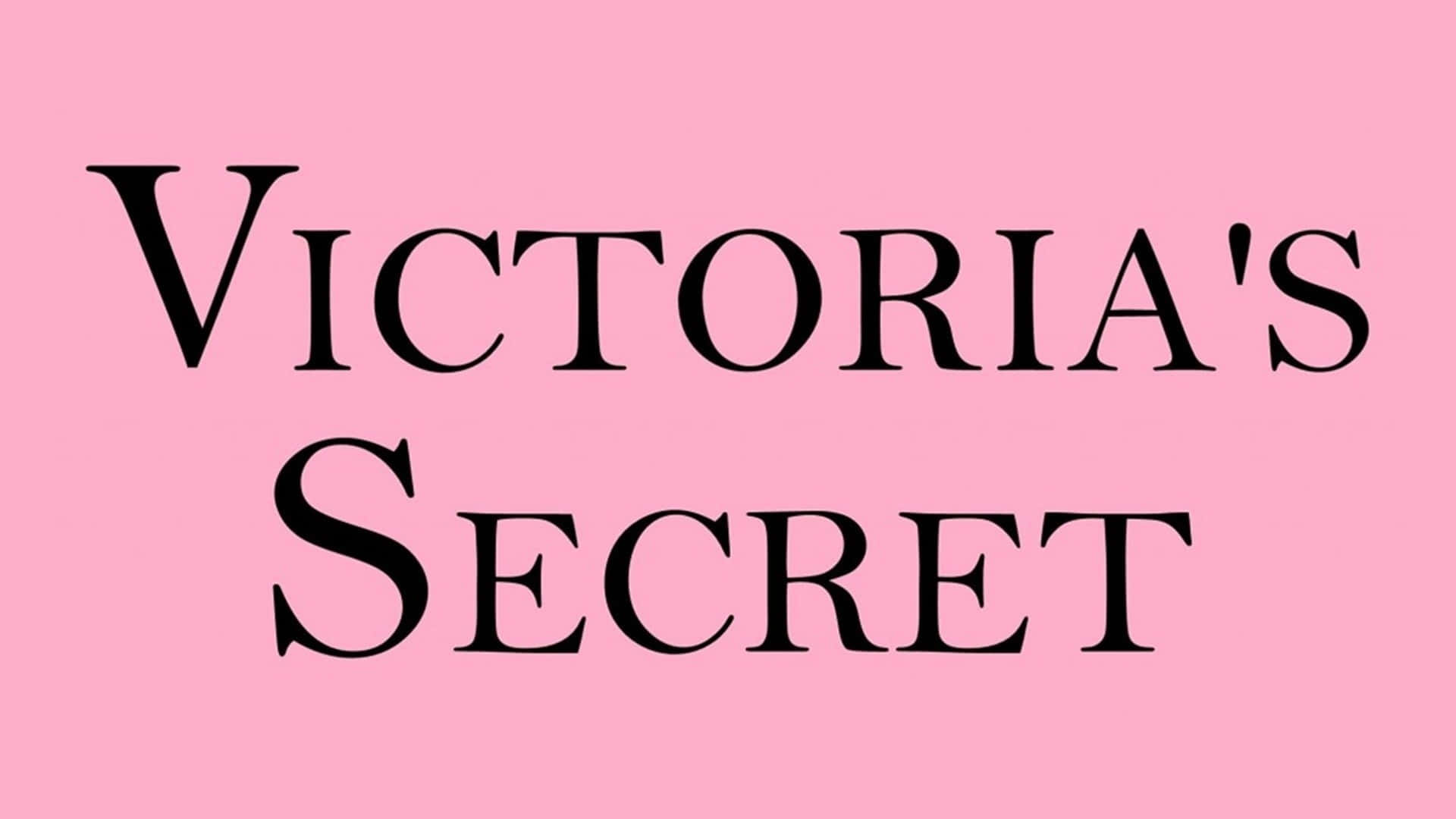 Victoria's Secret 桌布 壁紙 — 粗體黑色襯線文字在純色粉紅色背景上顯示 Victoria's Secret。