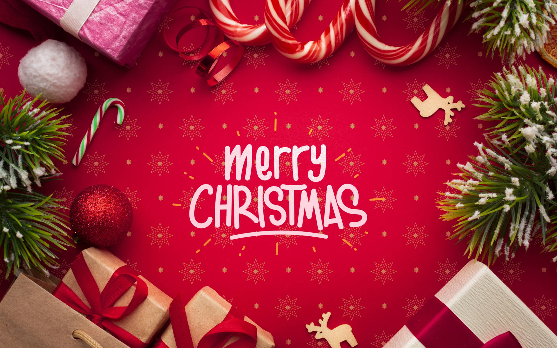 聖誕裝飾包括禮物、拐杖糖和松樹枝在紅色背景上，帶有Merry Christmas文字。