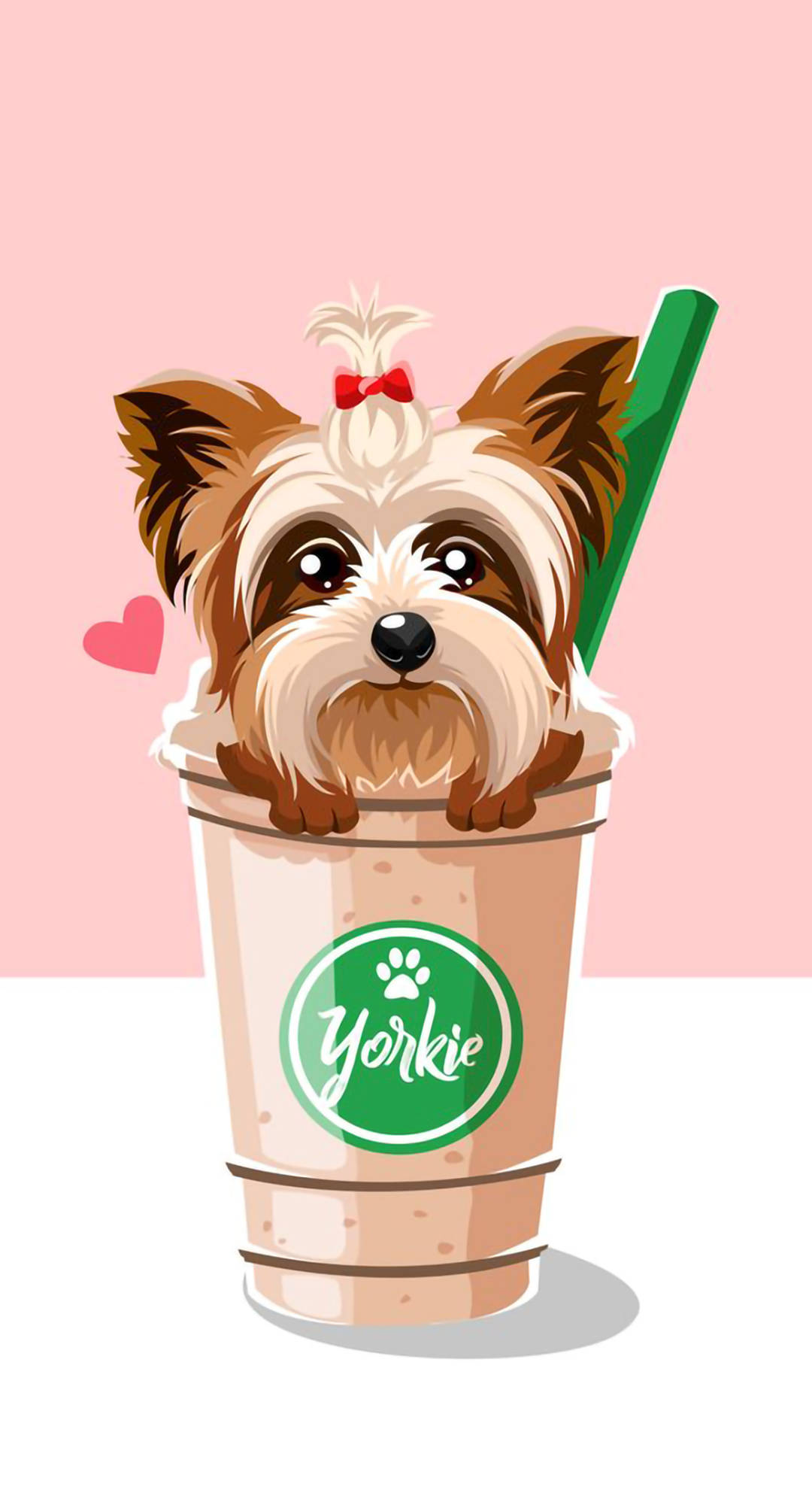 約克夏幼犬在咖啡杯中 壁紙 — 一隻可愛的約克夏㹴幼犬，戴著紅色蝴蝶結，從一個有綠色吸管的品牌飲料杯中探出頭來，背景是柔和的粉紅色。