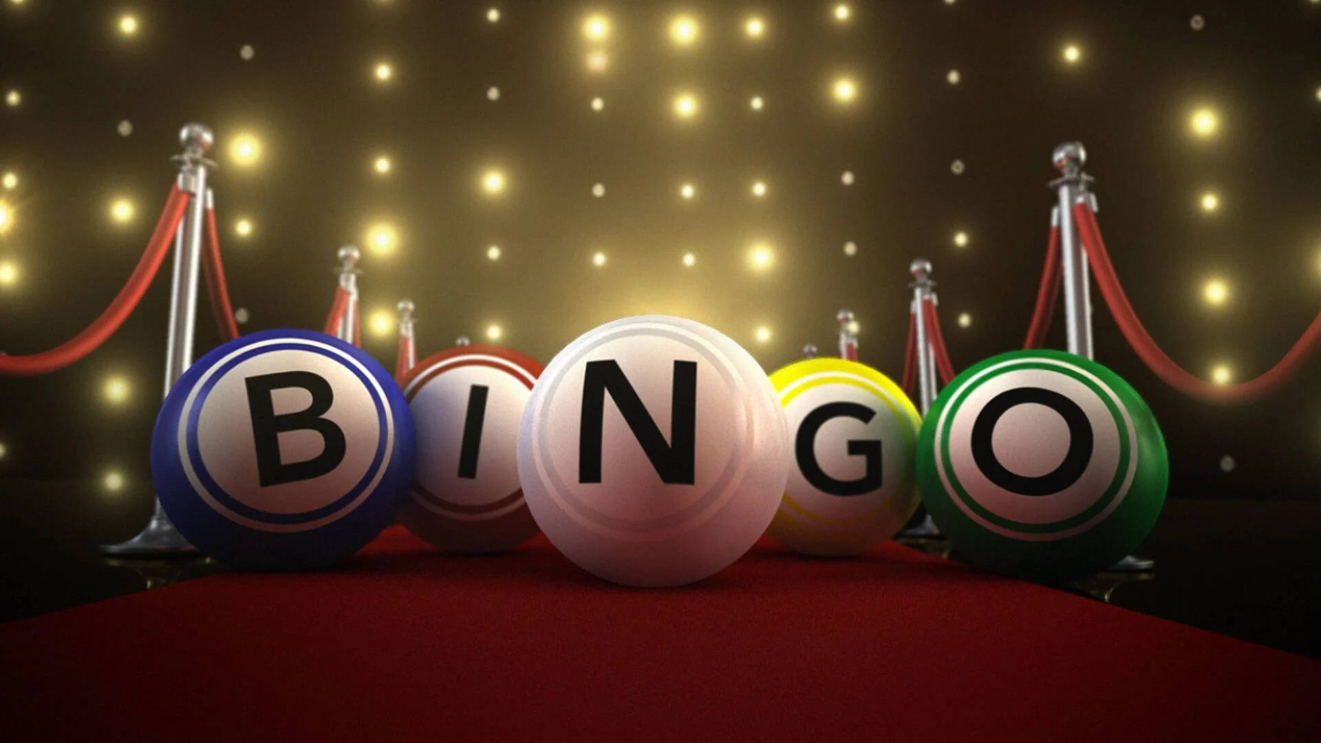 紅毯上的賓果球 壁紙 — 閃亮的賓果球拼出 BINGO，放在紅地毯上，兩旁有欄杆，上方有閃爍燈光。