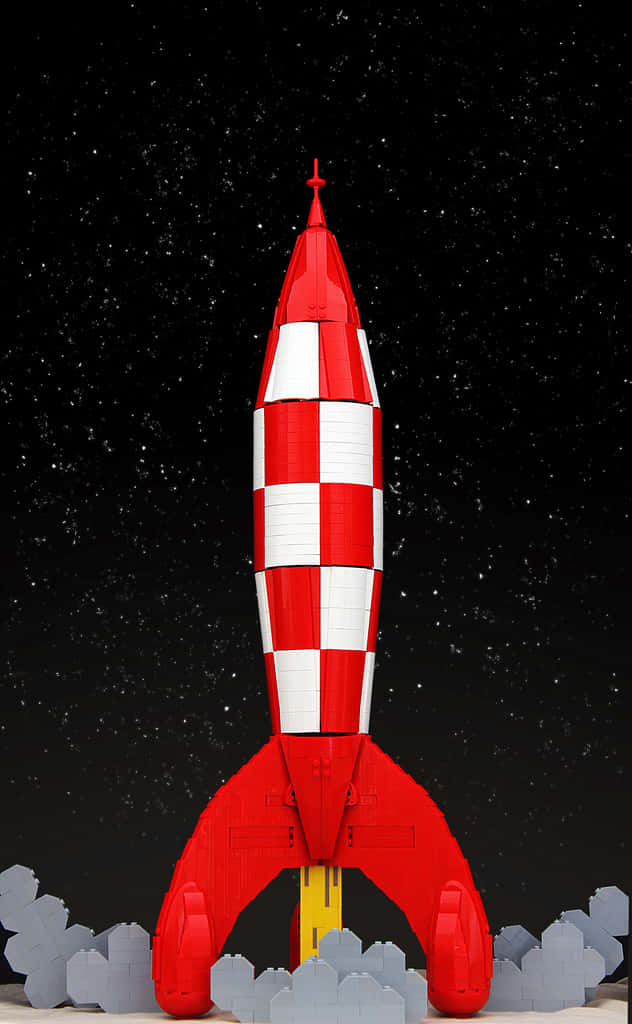 火箭 桌布 壁紙 — 紅白格仔LEGO火箭發射到滿天星斗的夜空，下方有灰色LEGO雲。