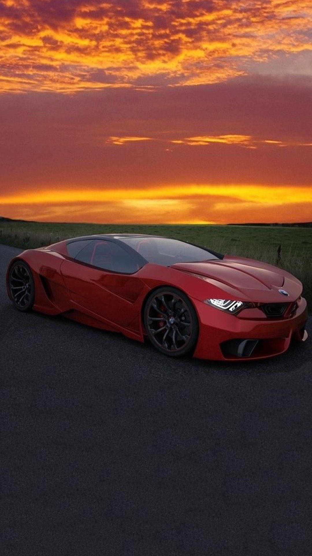紅色BMW M車iPhone壁紙 壁紙 — 一架流線型紅色跑車在寧靜的瀝青路上，於熾熱的橙粉紅色日落天空下閃耀。