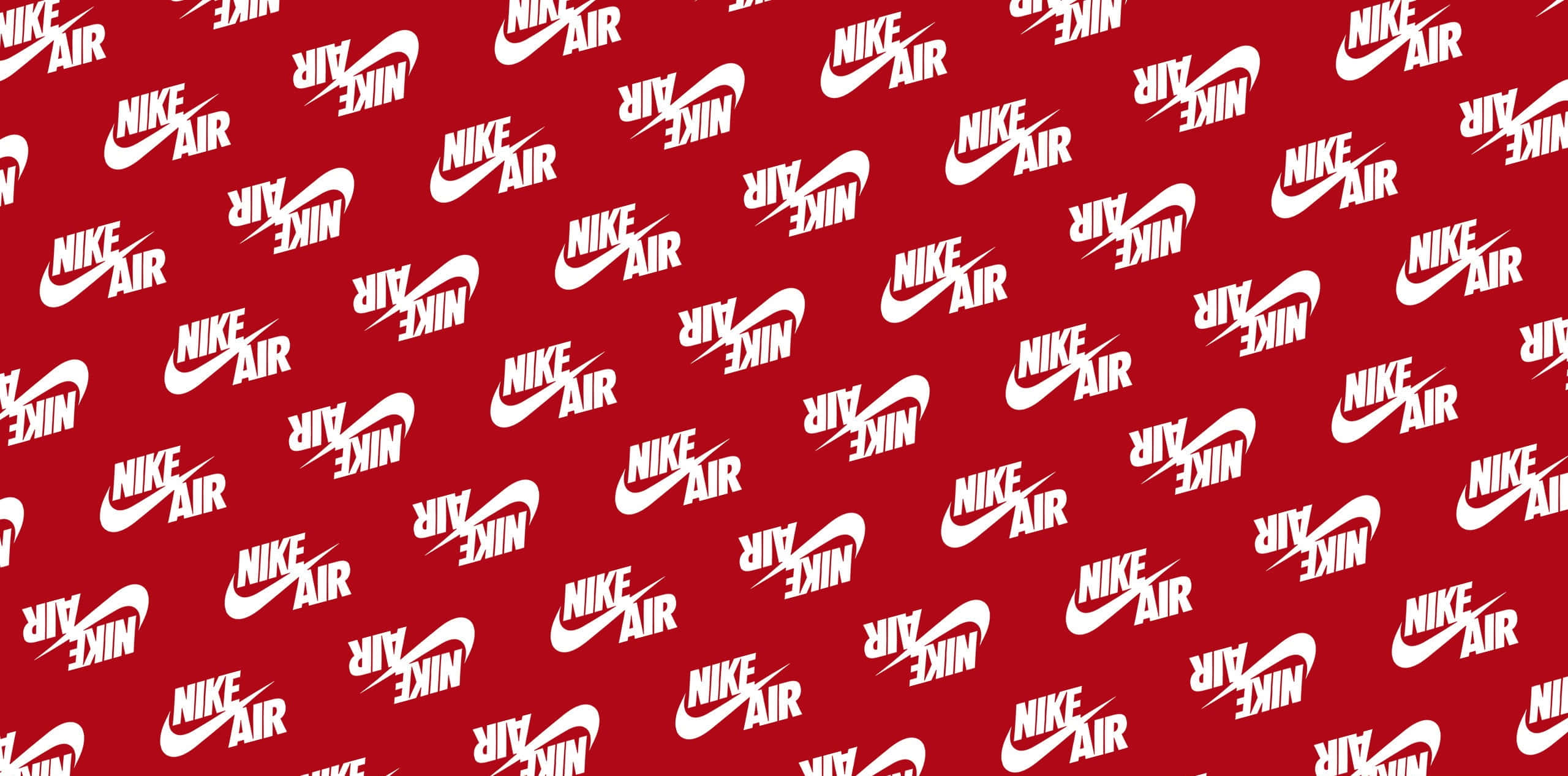 紅色Nike — 融合時尚與表現 壁紙 — 一個大膽的紅色背景，充滿重複的白色Nike Air標誌，呈現動態散佈的圖案。
