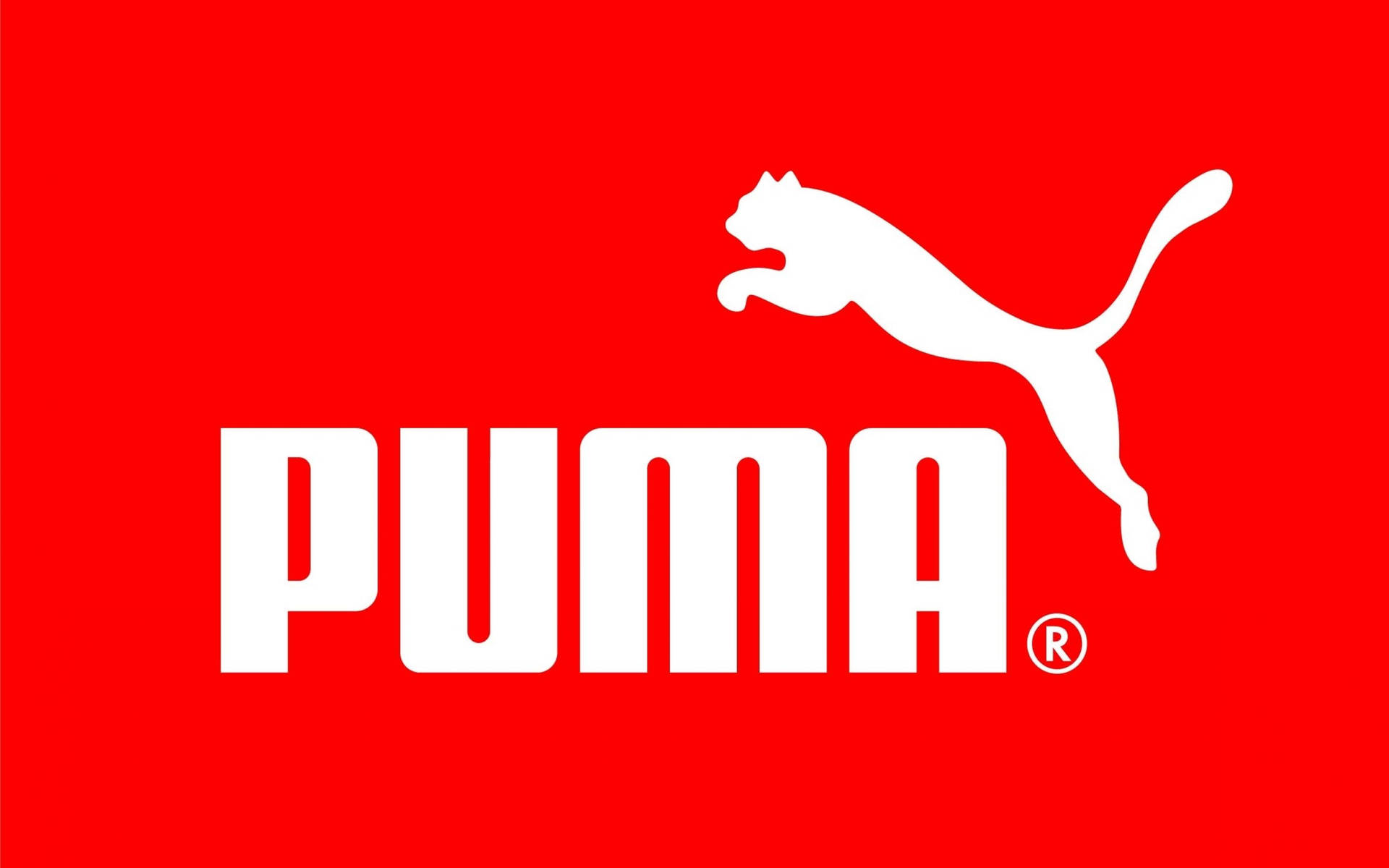 Puma品牌標誌，白色跳躍的貓和文字在紅色背景上