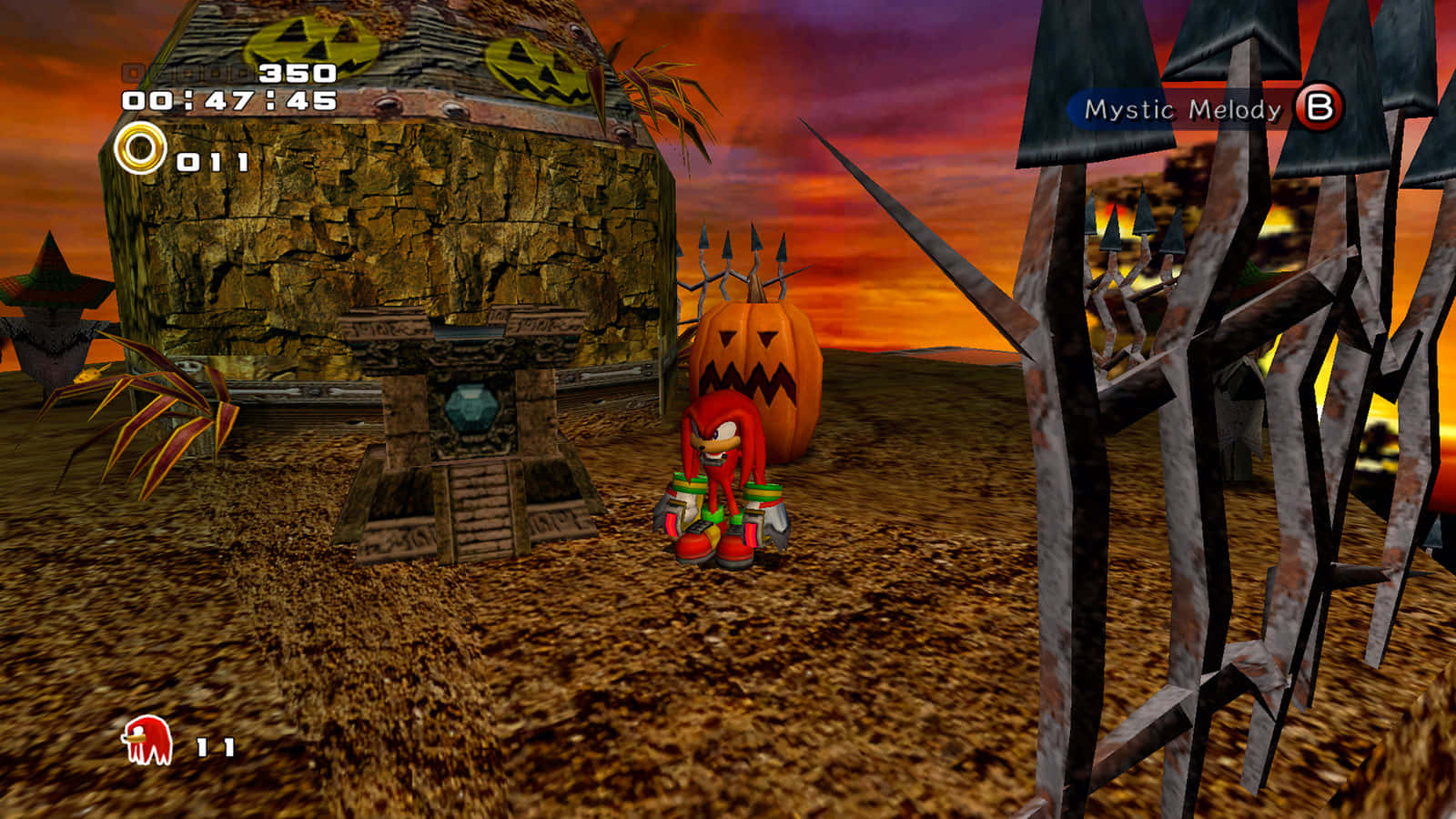 Sonic Pumpkin Hill 桌布 壁紙 — 紅色刺蝟站在一個萬聖節主題的電子遊戲關卡中，在火紅的日落前，面對一個詭異的南瓜屋。