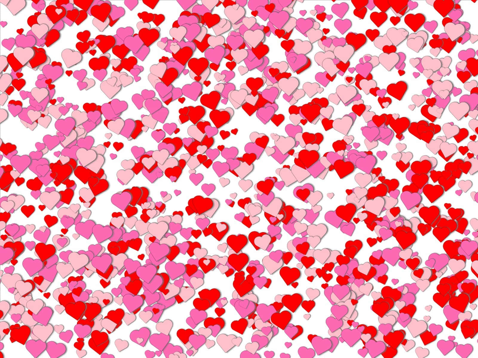 Heart Pattern 桌布 壁紙 — 紅色和粉紅色的心形圖案在潔白背景上形成充滿活力的瀑布效果，呈現節日五彩紙屑的圖案。