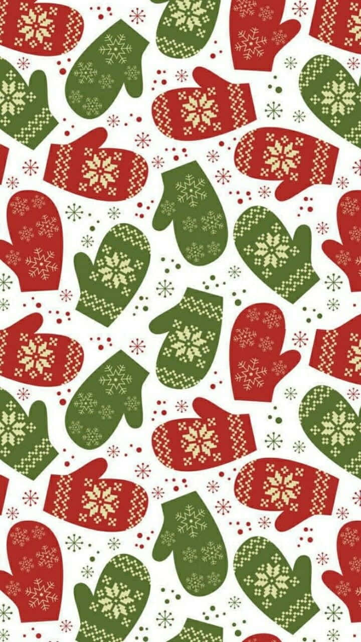 Mittens 桌布 壁紙 — 紅色和綠色的手套帶有雪花圖案，在白色背景上重複，背景上點綴著細小的節日圖標。