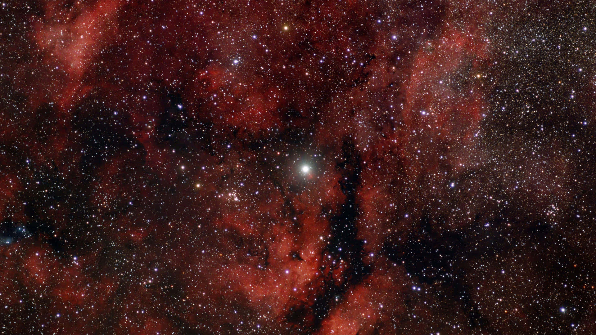 充滿星星的鮮紅色星雲在深空