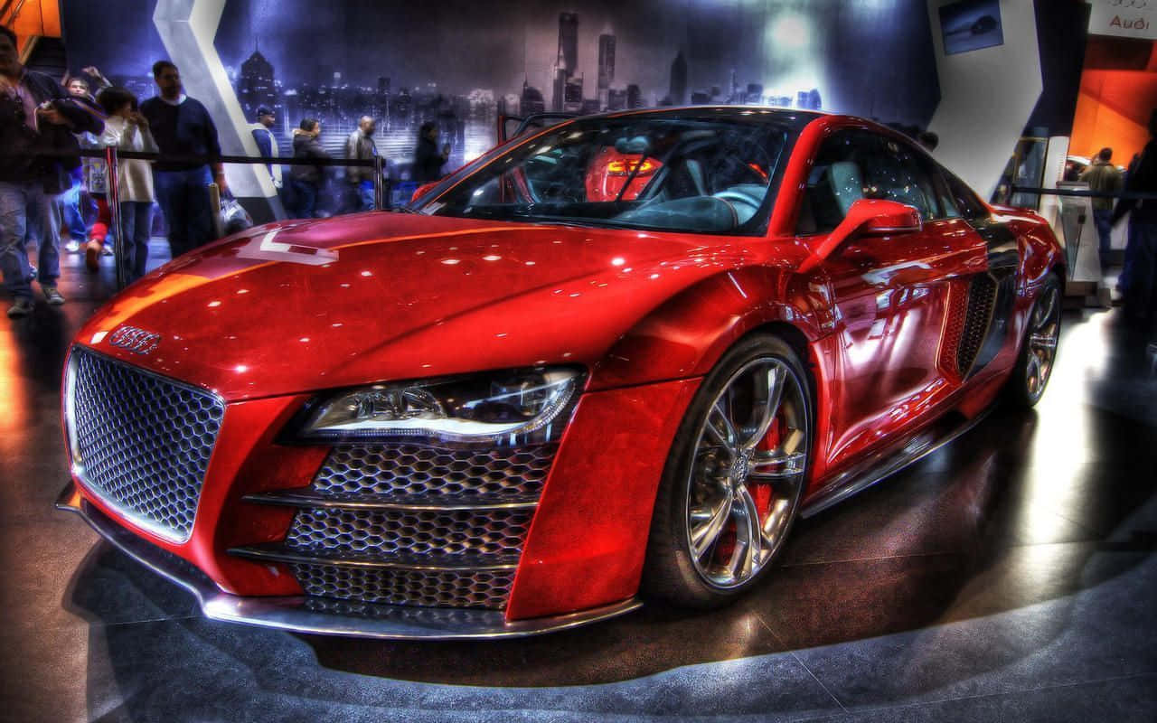 在車展上展示的光澤紅色奧迪R8跑車。