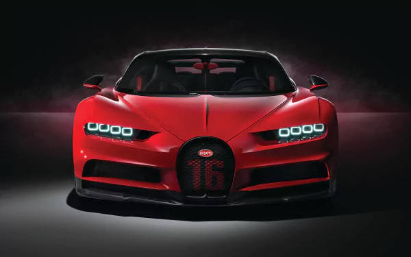 紅色Bugatti Chiron Super Sport 2020，帶有發光的頭燈和「16」標誌，在黑暗的攝影棚中。