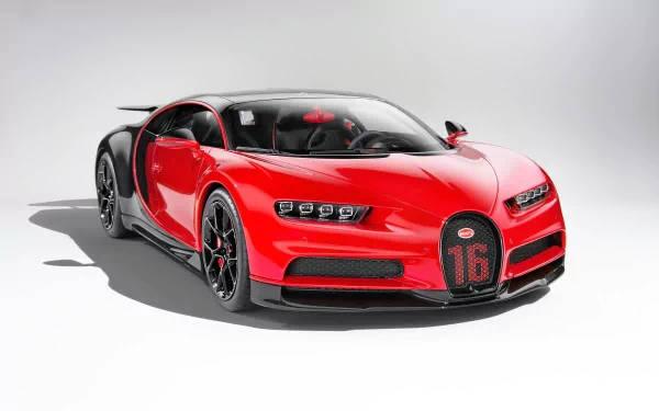 工作室中帶有黑色細節和格柵上16號數字的紅色Bugatti Chiron超級跑車。