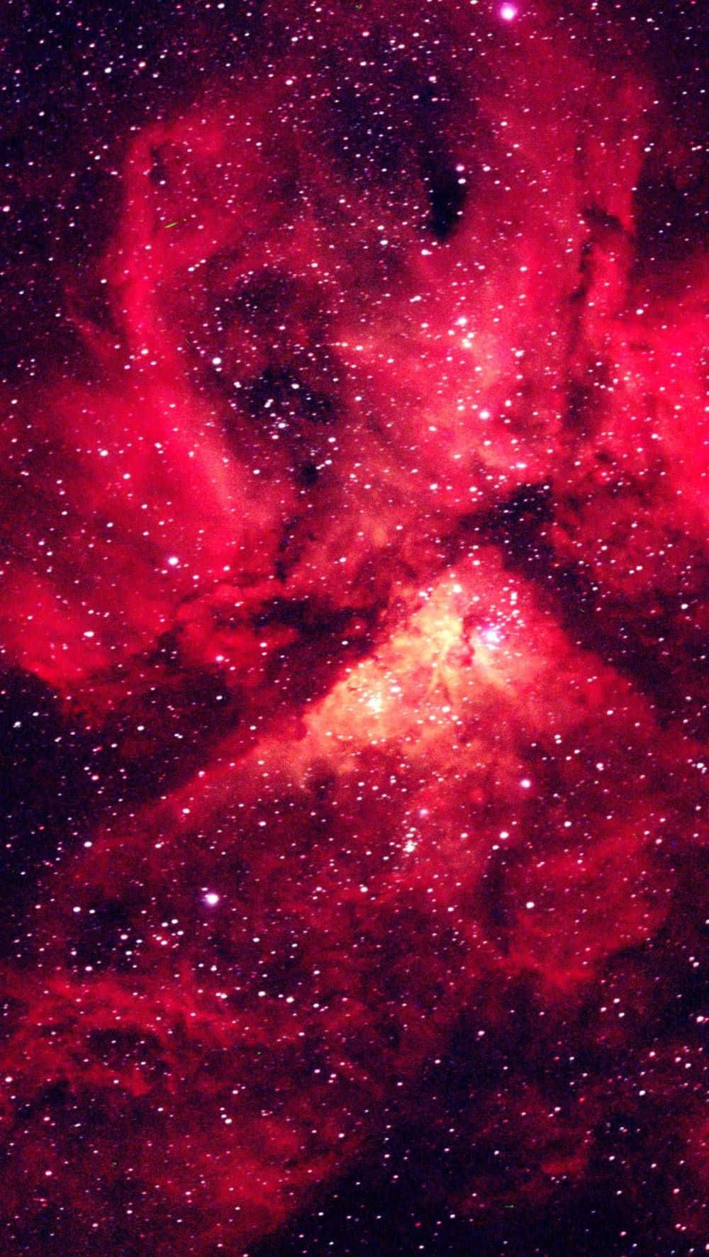 一個充滿星星和宇宙塵埃的紅色星雲，在深邃的太空中。
