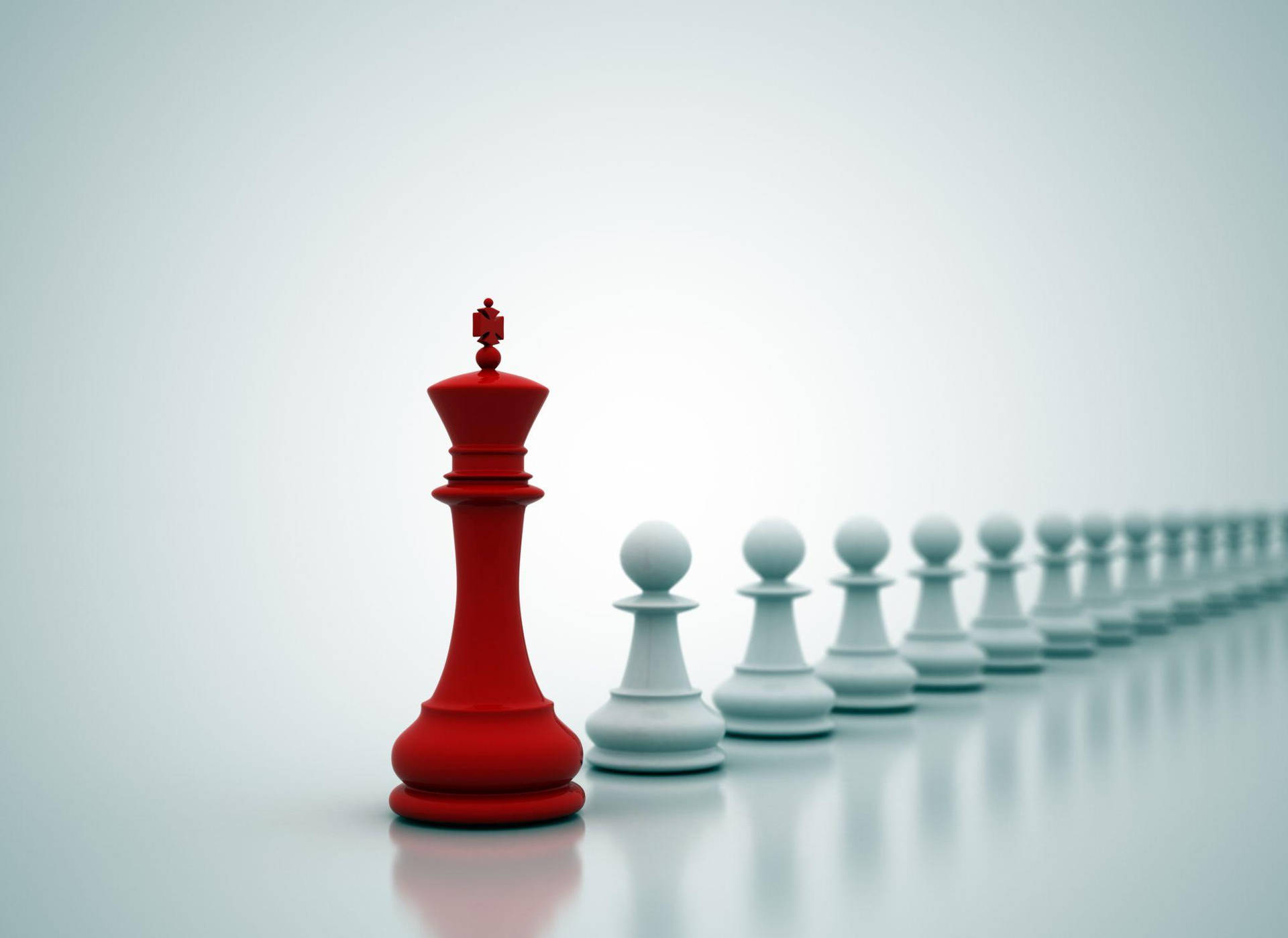 一個紅色國際象棋國王面對一排白色兵卒，在乾淨的反射表面上。