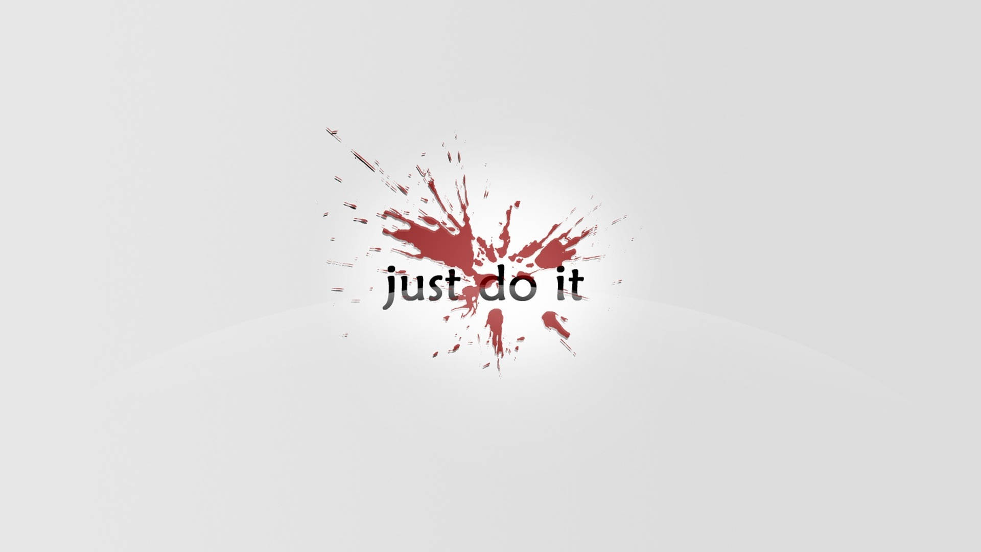 紅色標語耐克iPhone 壁紙 — 粗體黑色文字 just do it 從動態的紅色油漆飛濺中迸發出來，背景是簡約的淺灰色。