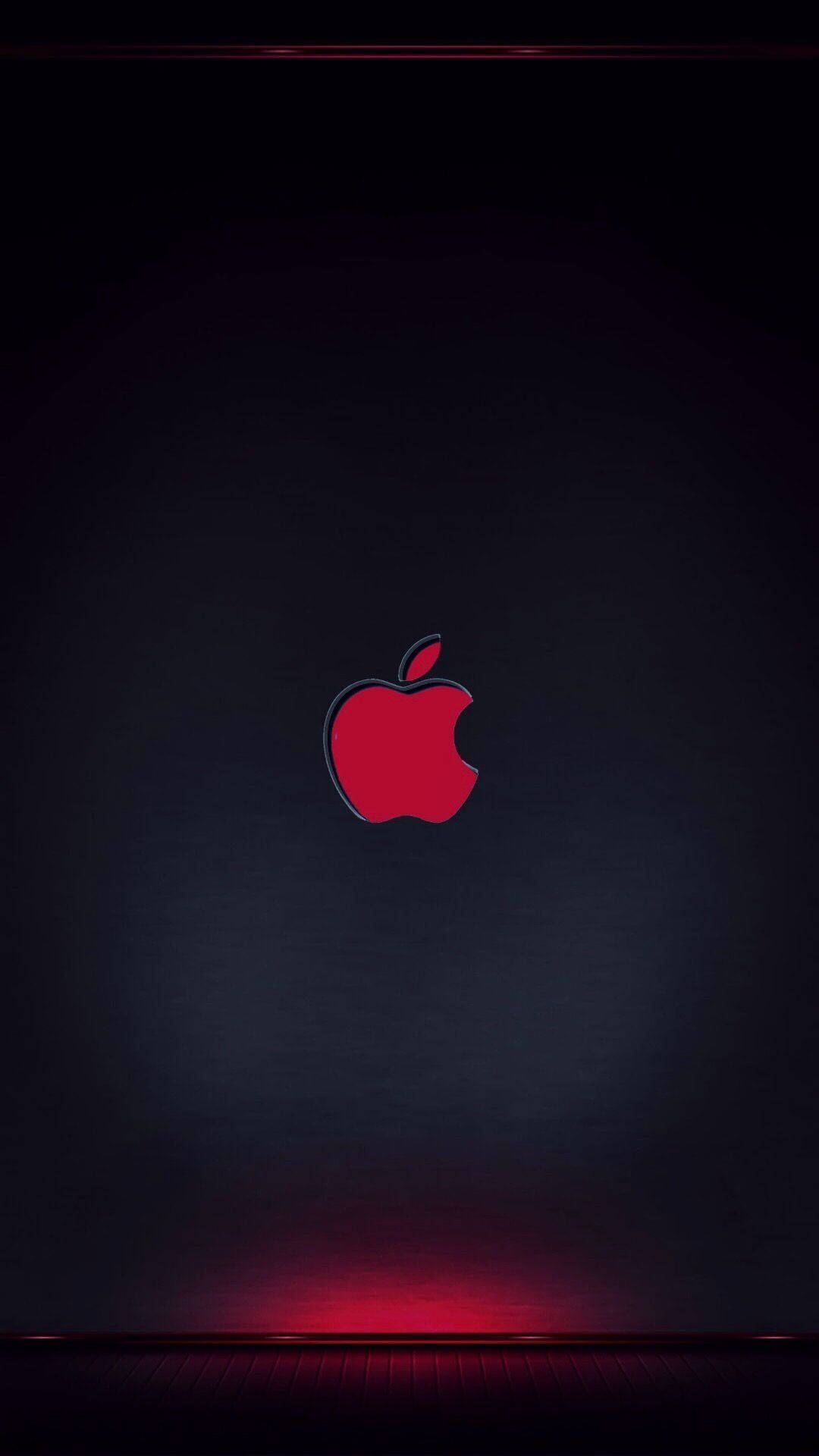 紅色Apple標誌在深色漸變背景上被紅色燈光點綴照亮。