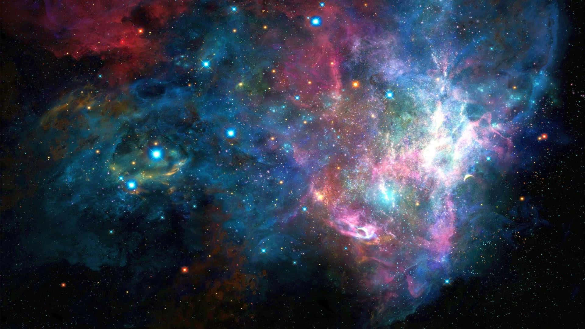 紅藍光暈天際背景 壁紙 — 一個充滿活力的宇宙星雲，在佈滿星星的黑色虛空中，旋轉著電光藍、粉紅和火紅的色彩。