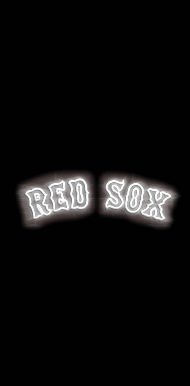 黑色背景上發光的霓虹 red sox 標誌。