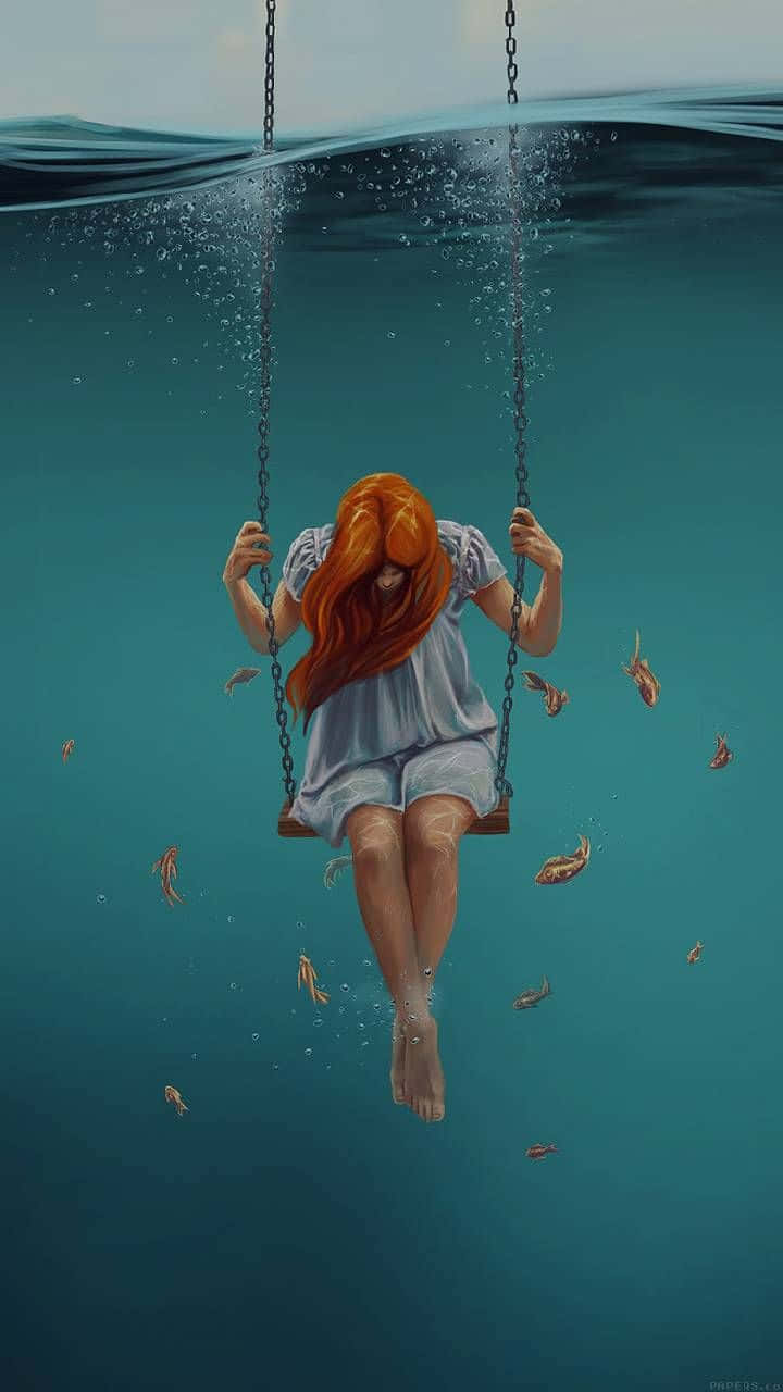 紅髮女孩在水下鞦韆上，被魚群環繞