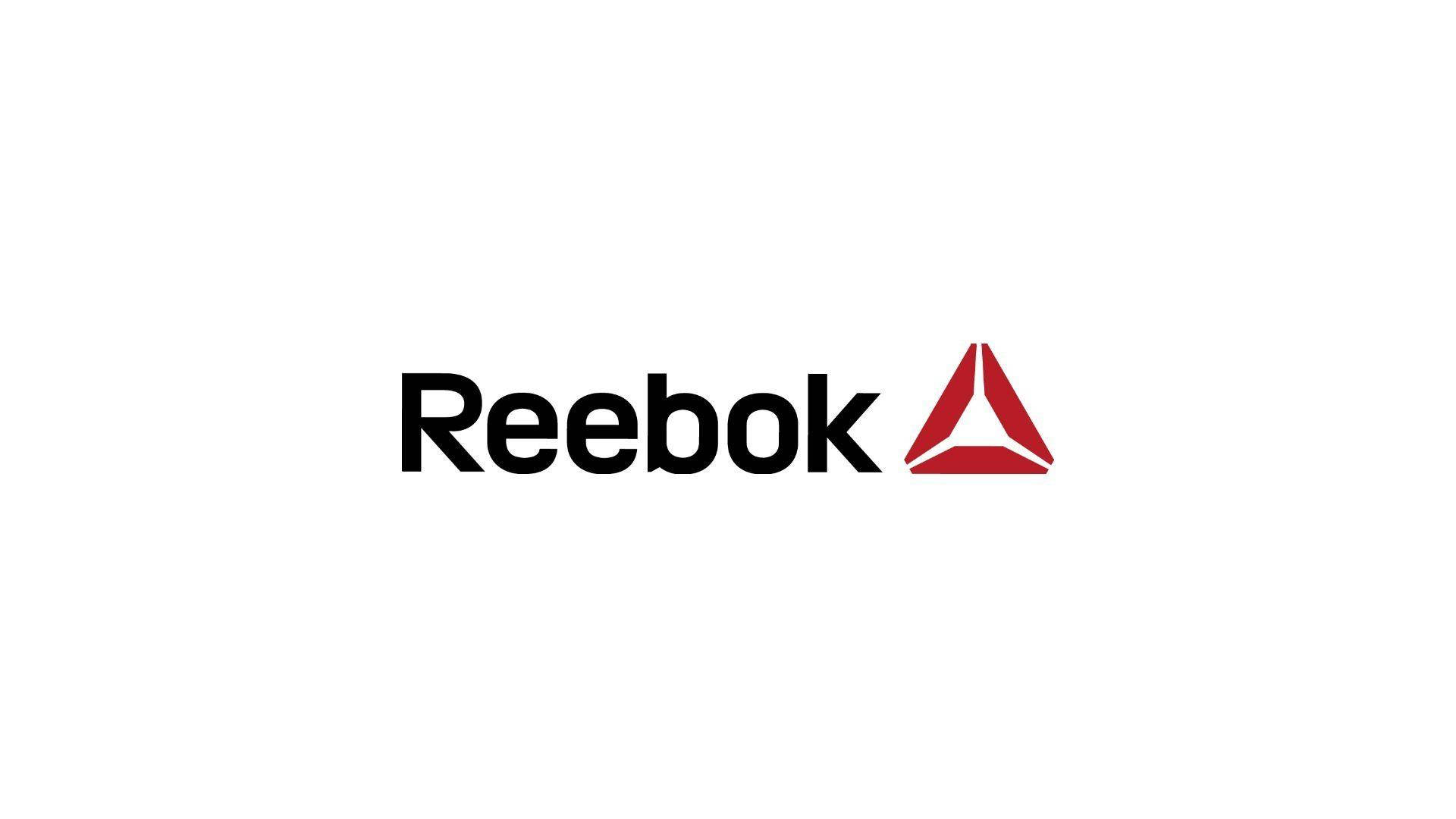 Reebok 品牌標誌，黑色文字和紅色三角形在白色背景上。