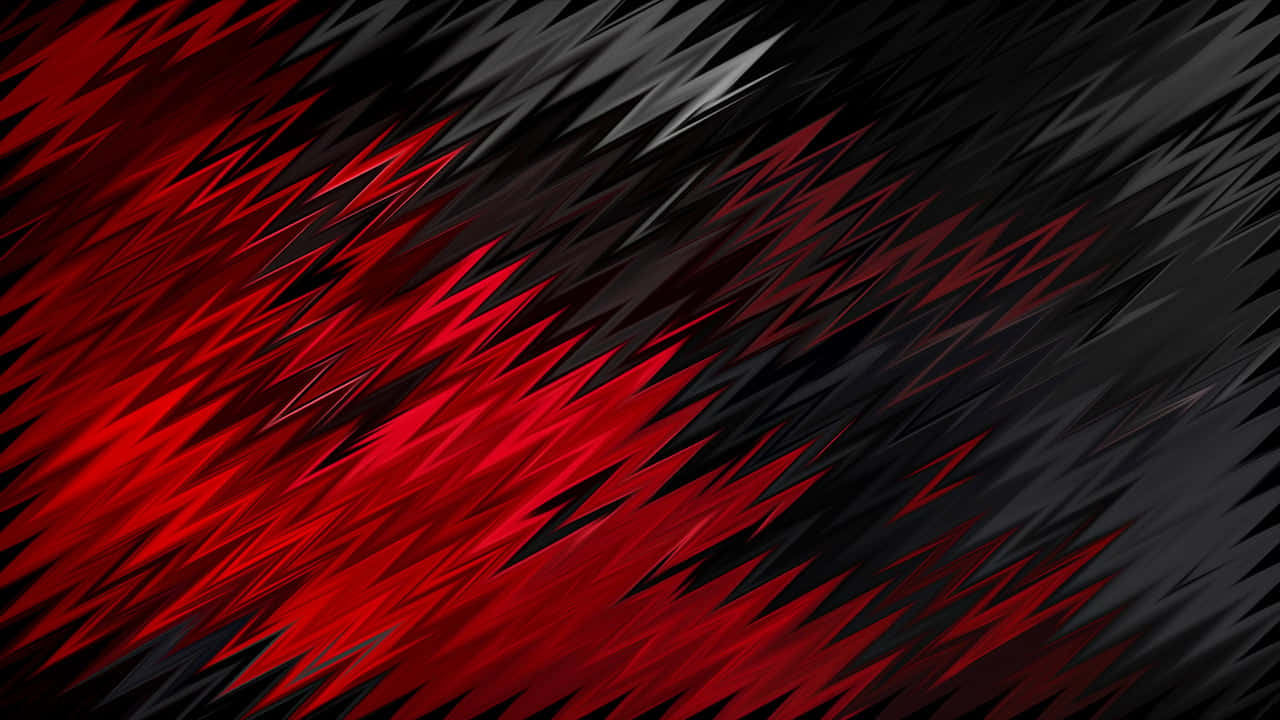 紅黑模糊向量藝術 壁紙 — 充滿活力的紅色和黑色鋸齒圖案對角線延伸，橫跨動態抽象數位背景。
