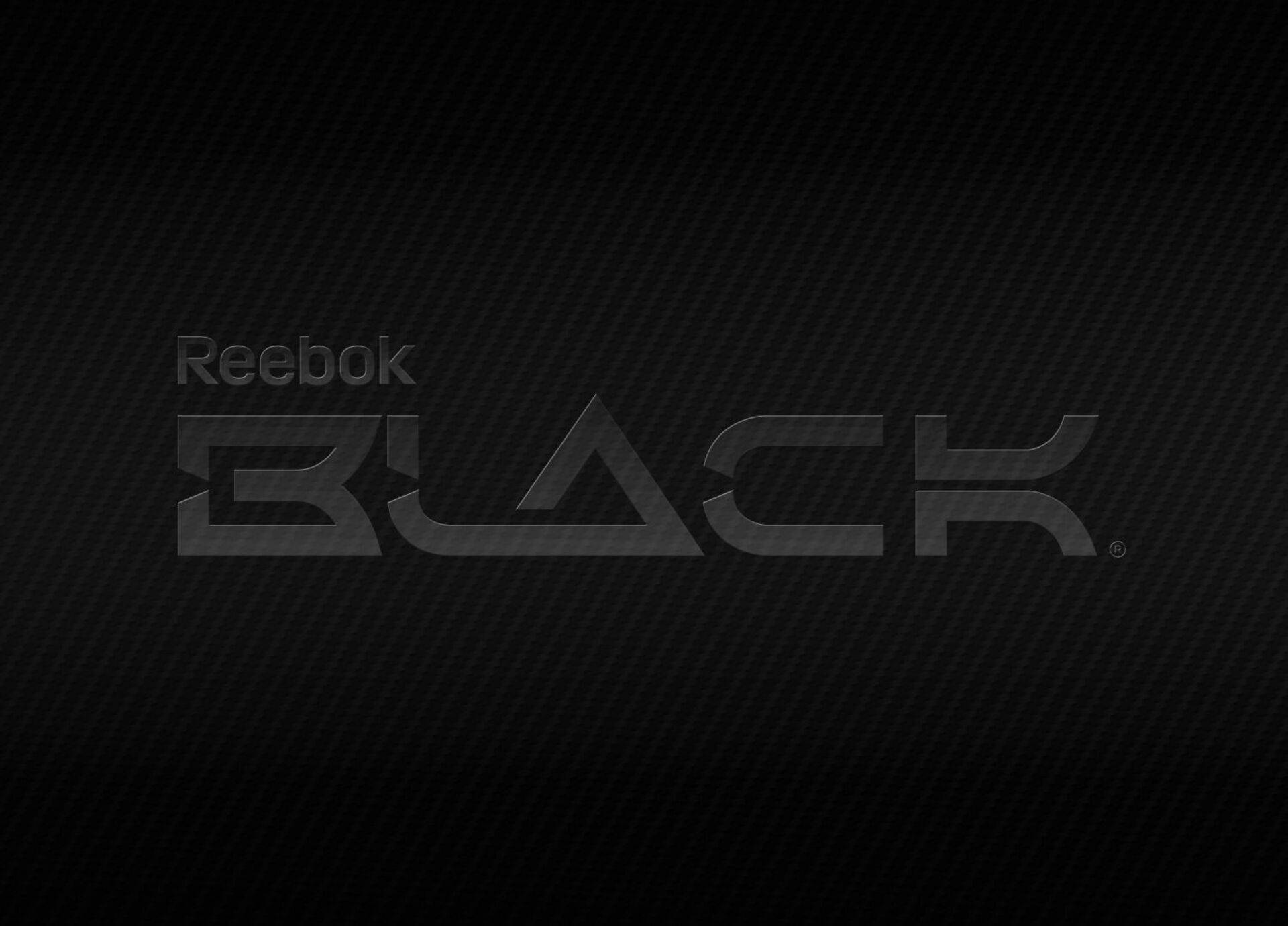 碳纖維紋理背景上的 Reebok BLACK 標誌