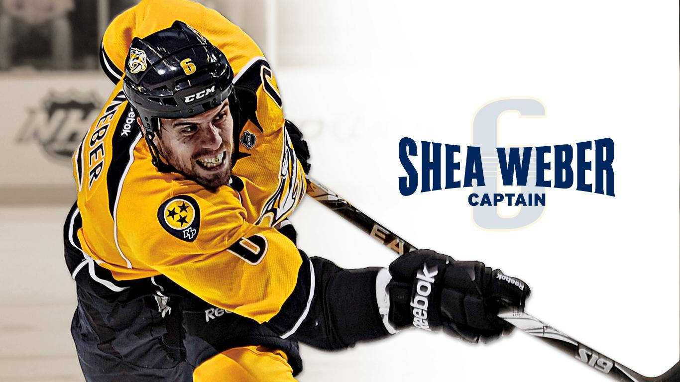 納什維爾掠奪者隊標誌，雪伊·韋伯在比賽中 壁紙 — 冰球運動員 Shea Weber 身穿黃黑色制服，在冰上緊握球棍，表情猙獰。