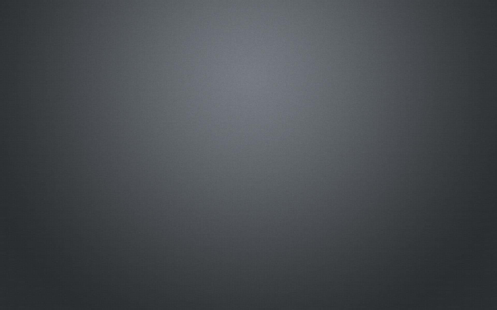 純深灰配聚光燈背景 壁紙 — 極簡漸變灰色背景，帶有從深色中心漸變到淺色中心的細微圓點圖案。