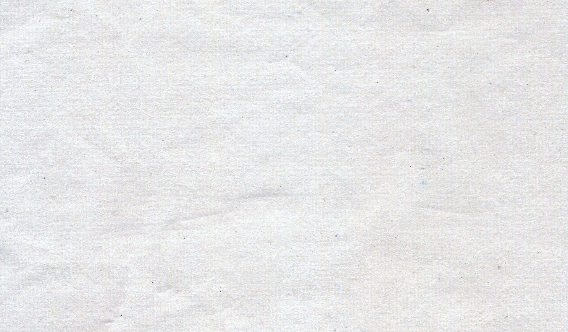 白色皺紙的特寫，帶有細微紋理和淡淡斑點。