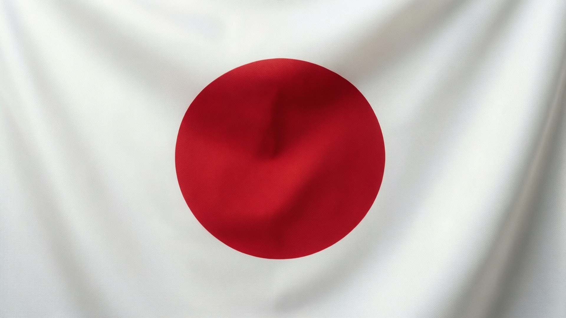 純粹日之丸極簡風 壁紙 — 日本國旗的特寫，顯示白色布料背景上居中嘅紅色圓圈，帶有柔和嘅摺痕。