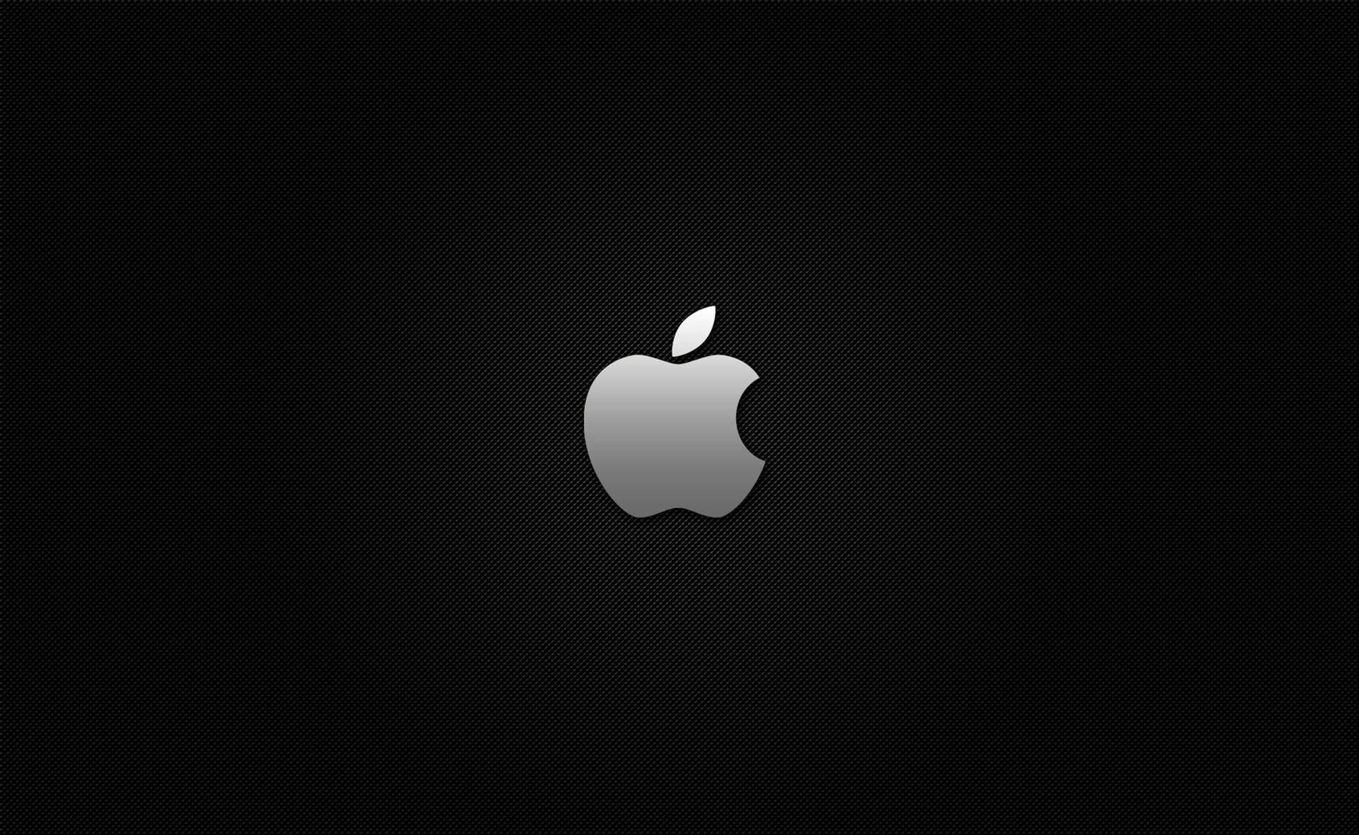 銀色Apple標誌在黑色紋理背景上