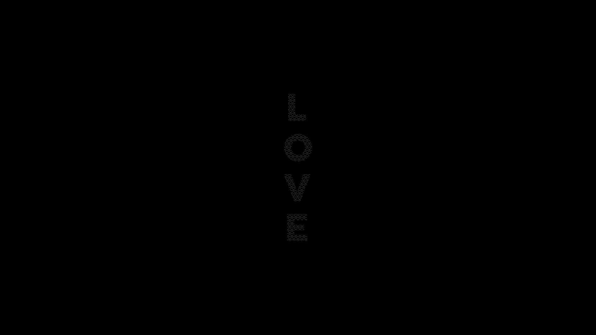 由灰色點組成的垂直文字 LOVE，黑色背景