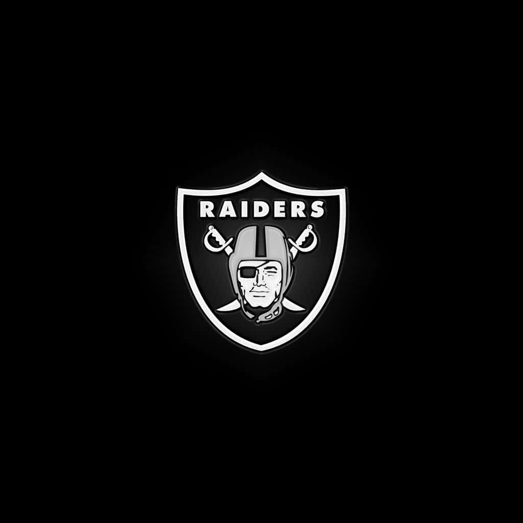 Raiders 足球隊標誌在黑色背景上帶有發光輪廓 — 掠奪者 壁紙