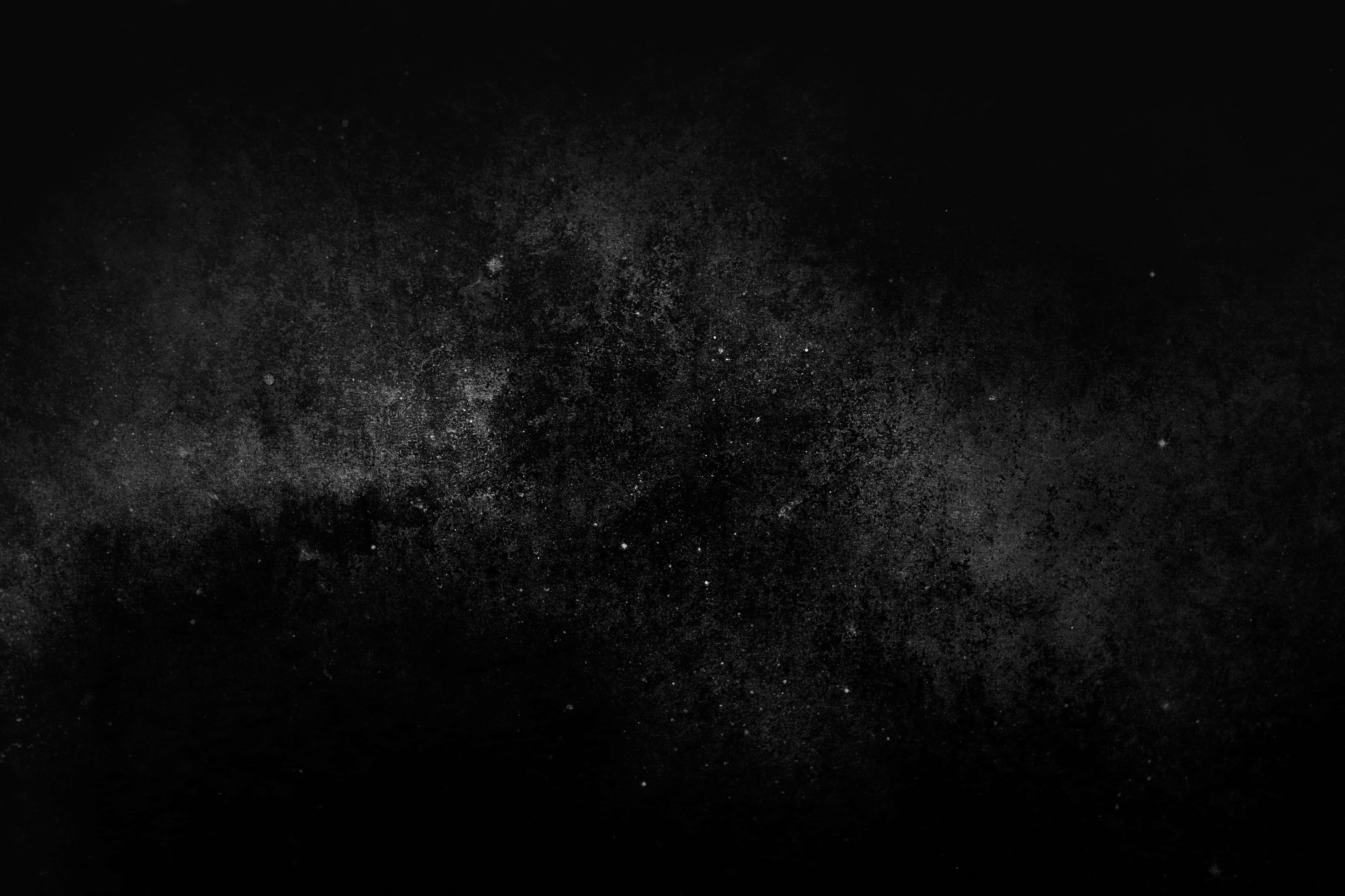 Dark Grunge 桌布 壁紙 — 純黑色背景，帶有微妙的灰色灰塵顆粒和類似遙遠星星的微弱斑點。