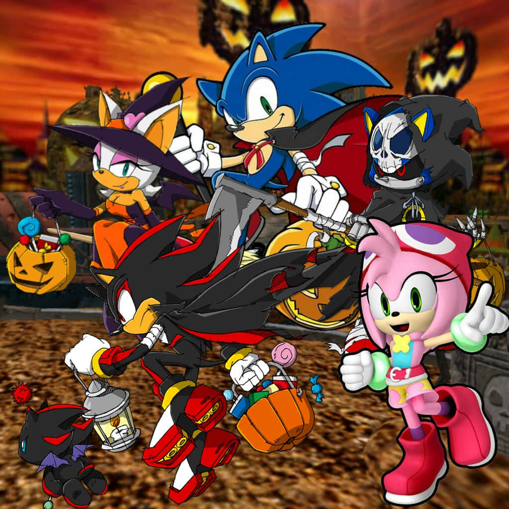 Sonic Pumpkin Hill 桌布 壁紙 — 索尼克和朋友們穿著萬聖節服裝，在火紅的橙色天空和南瓜燈籠前愉快地擺姿勢。