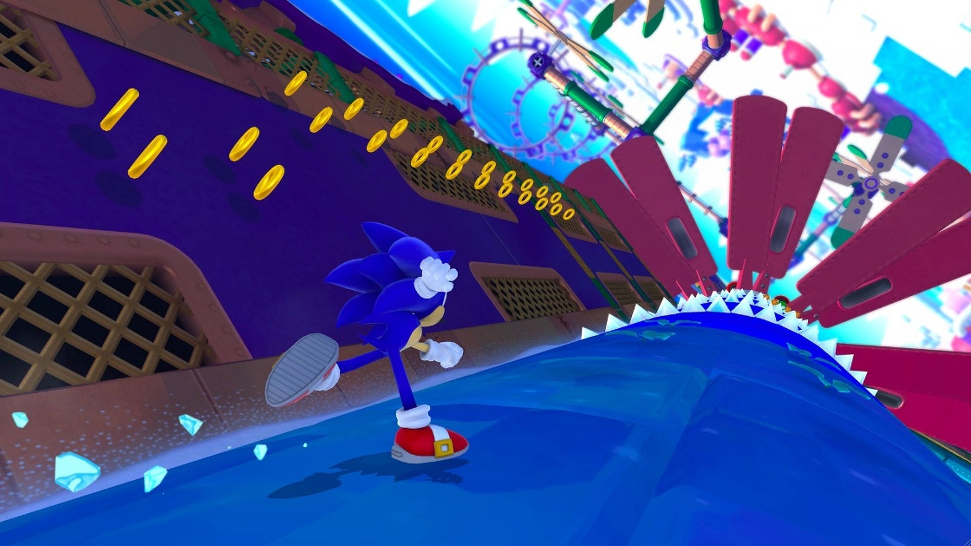索尼克迷失世界冰凍工廠 壁紙 — Sonic the Hedgehog 在充滿活力的未來城市景觀中飛馳，收集金色環圈。