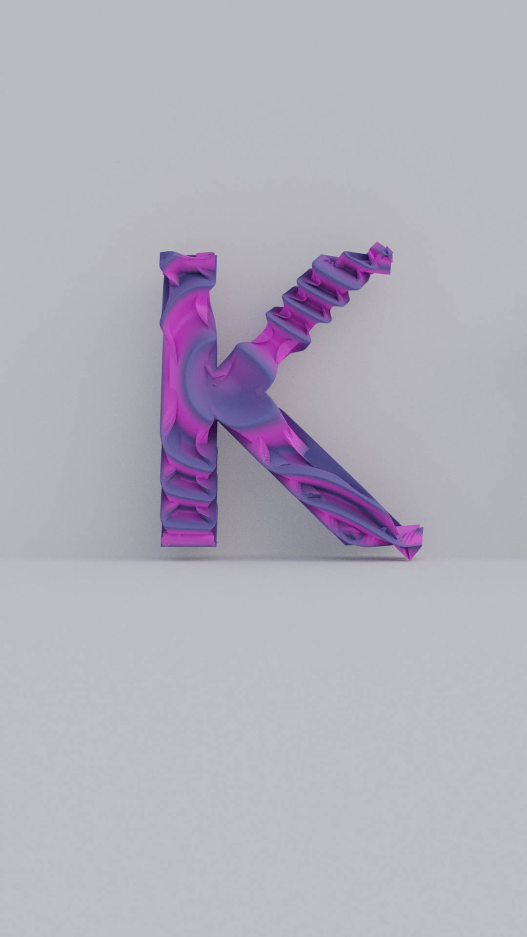 一個風格化的3D字母K，帶有旋轉的紫色和粉紅色金屬圖案。