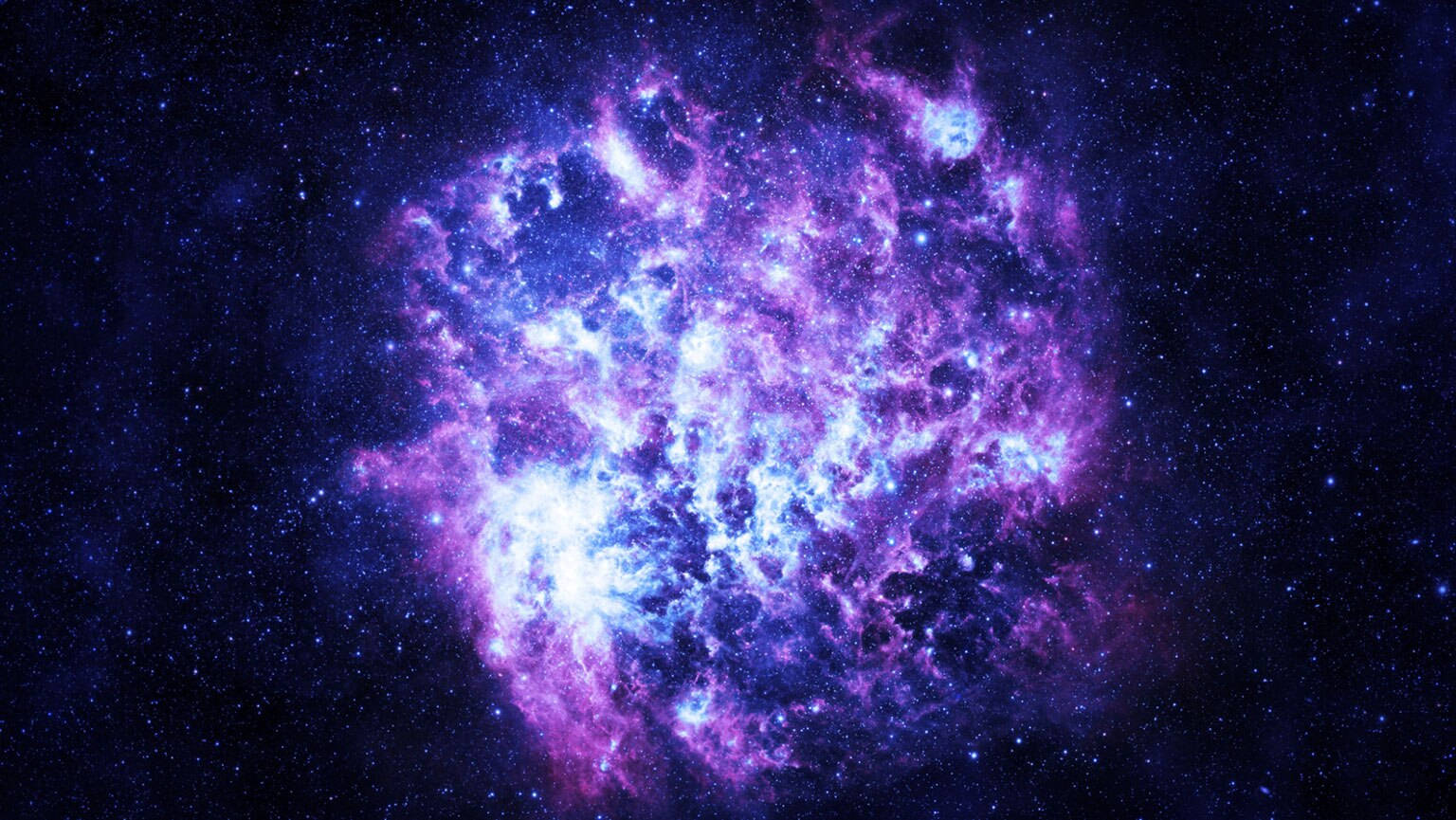 一個在深空中充滿星星的發光紫色和藍色星雲。