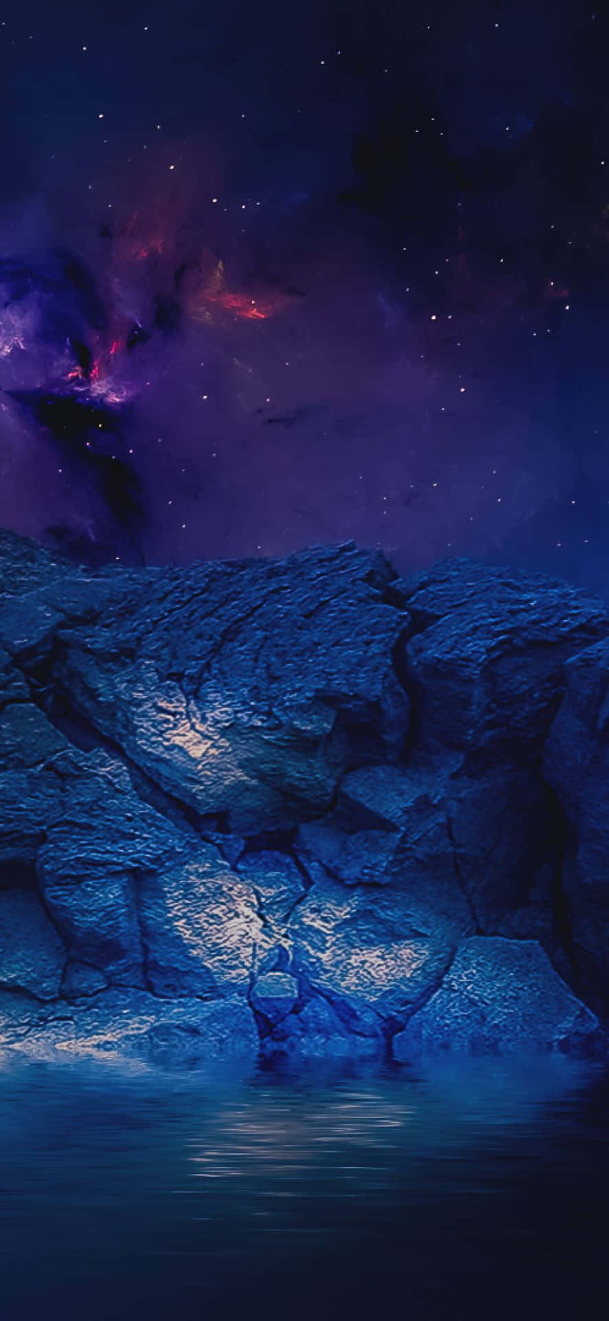 深藍色岩石在靜止的水面上倒映，下方是色彩繽紛、佈滿星星的星雲天空。