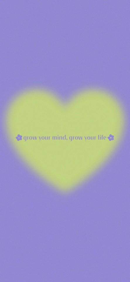 在紫色背景上帶有grow your mind grow your life文字的發光心形