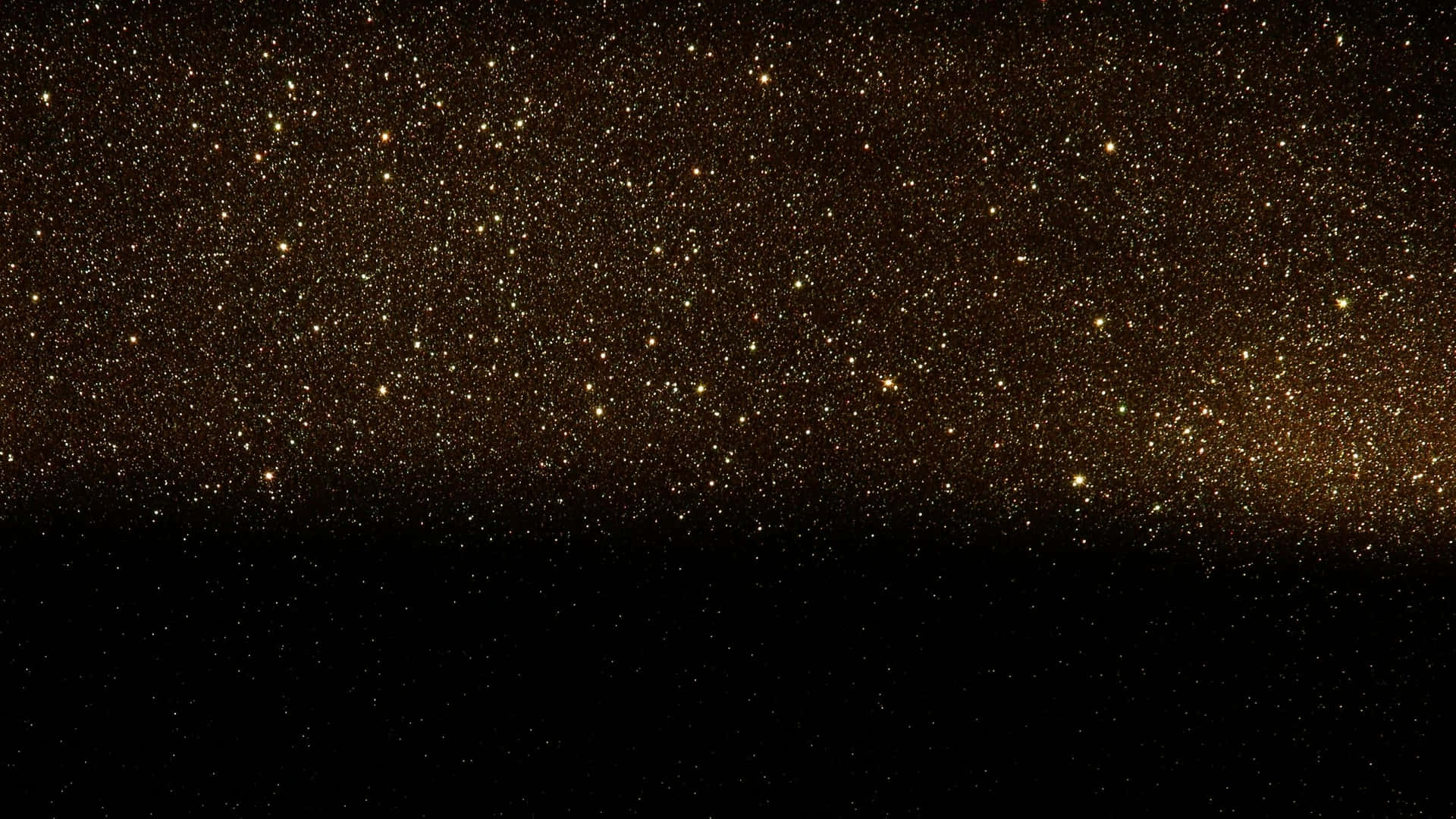 金色星星在黑色天空地平線上閃爍。